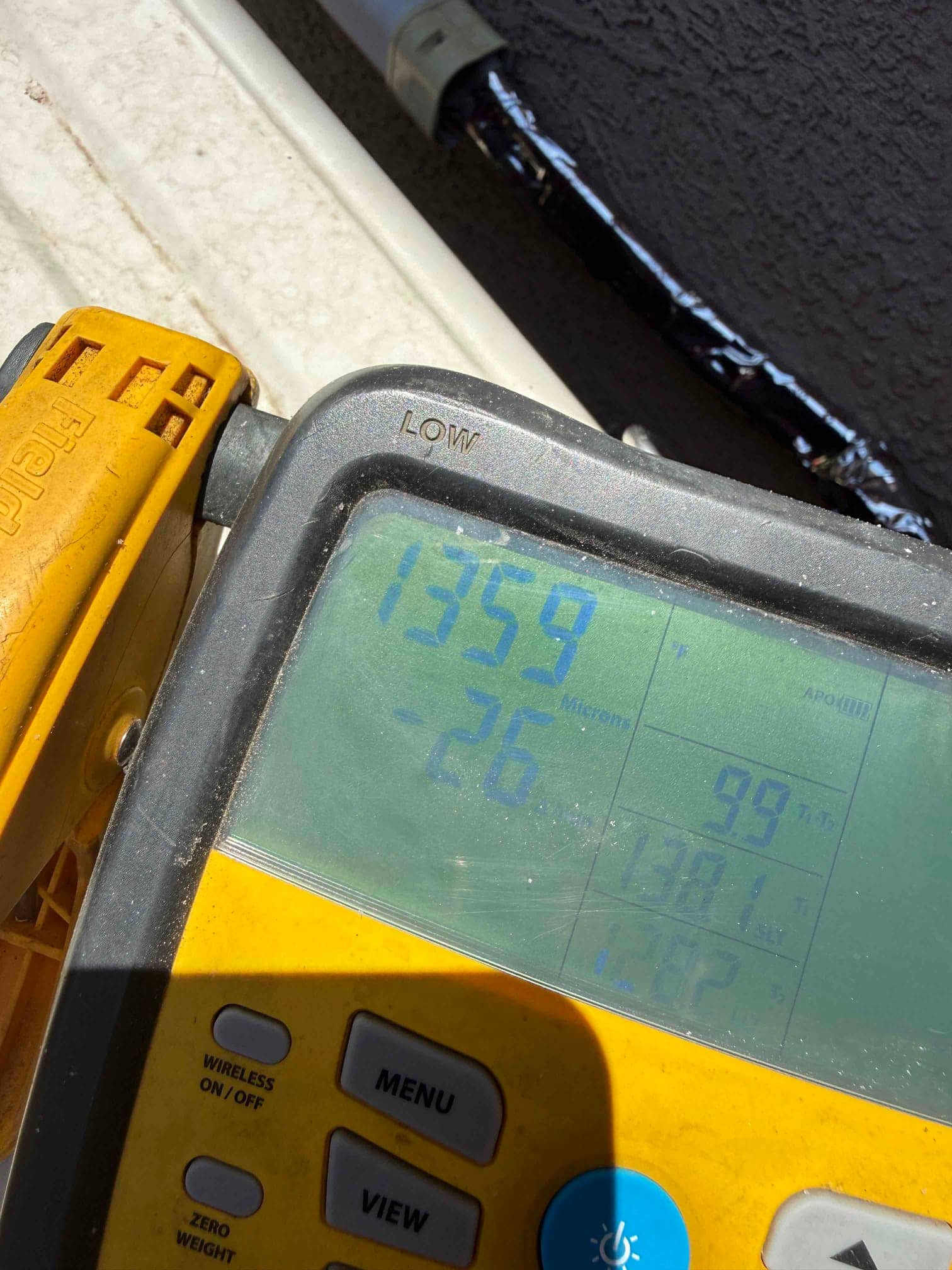 Diagnostic instrument display shows 1359 microns.