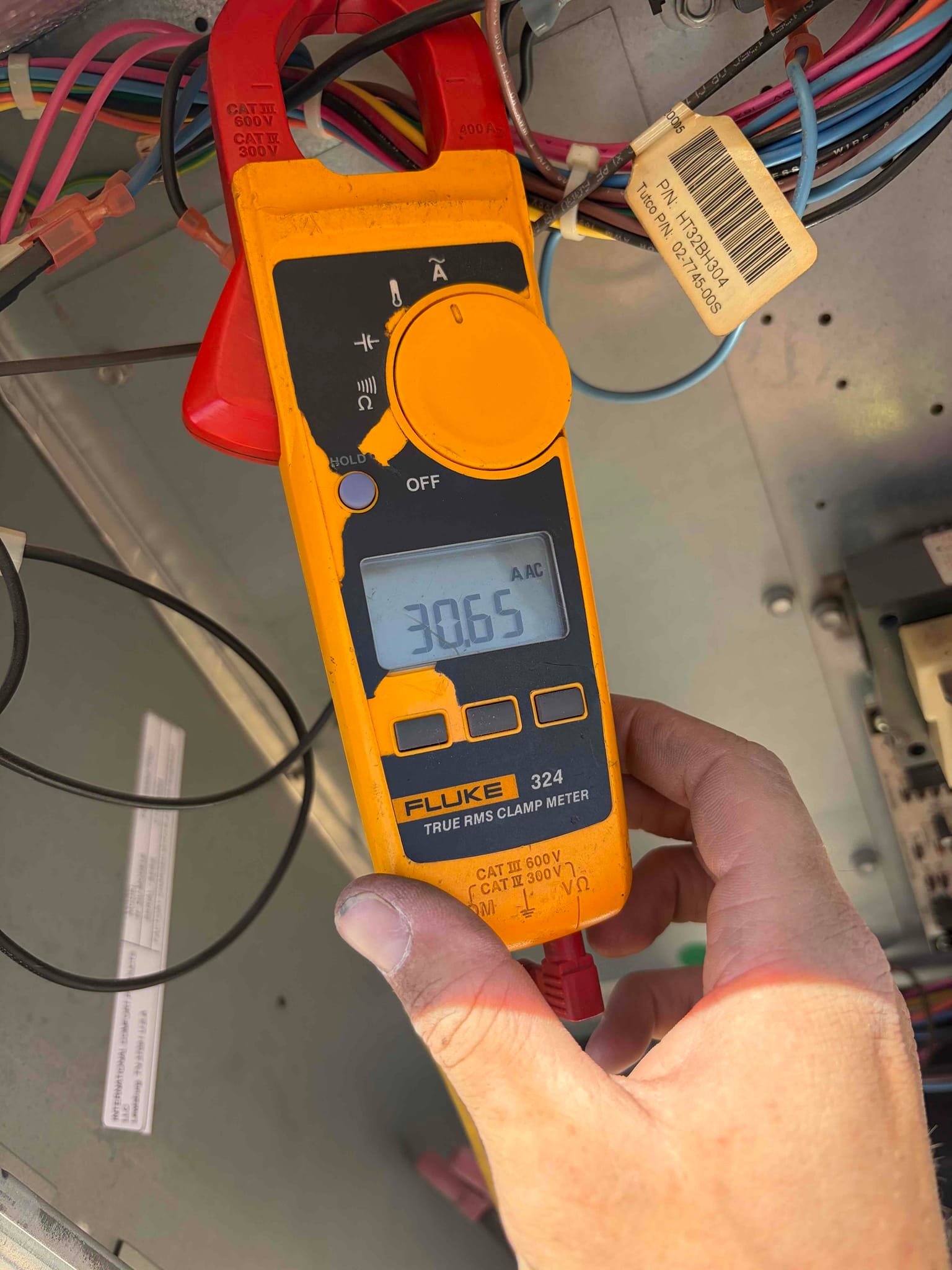 Diagnostic instrument display shows 30.65 A.