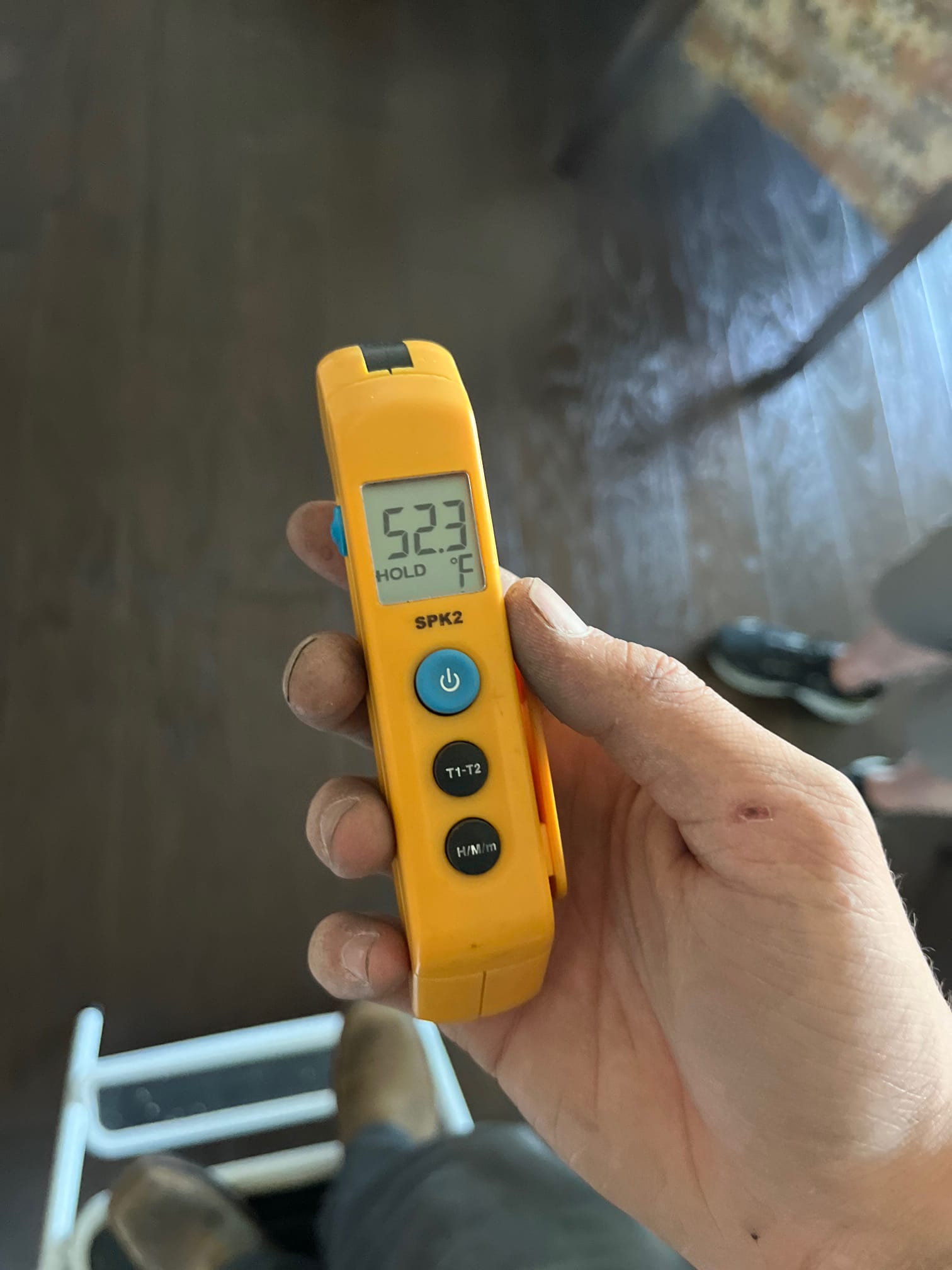 Diagnostic instrument display shows 52.3 °F.
