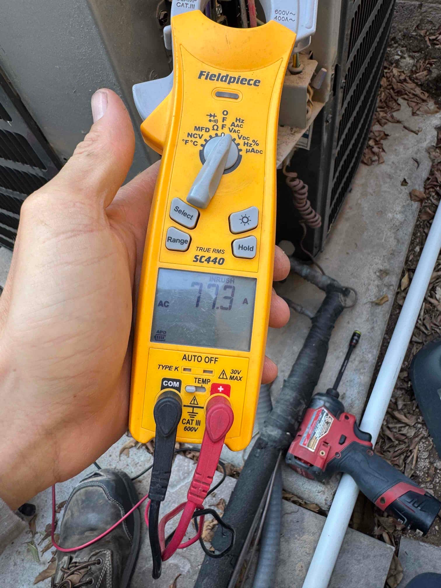 Diagnostic instrument display shows 7.73 A.