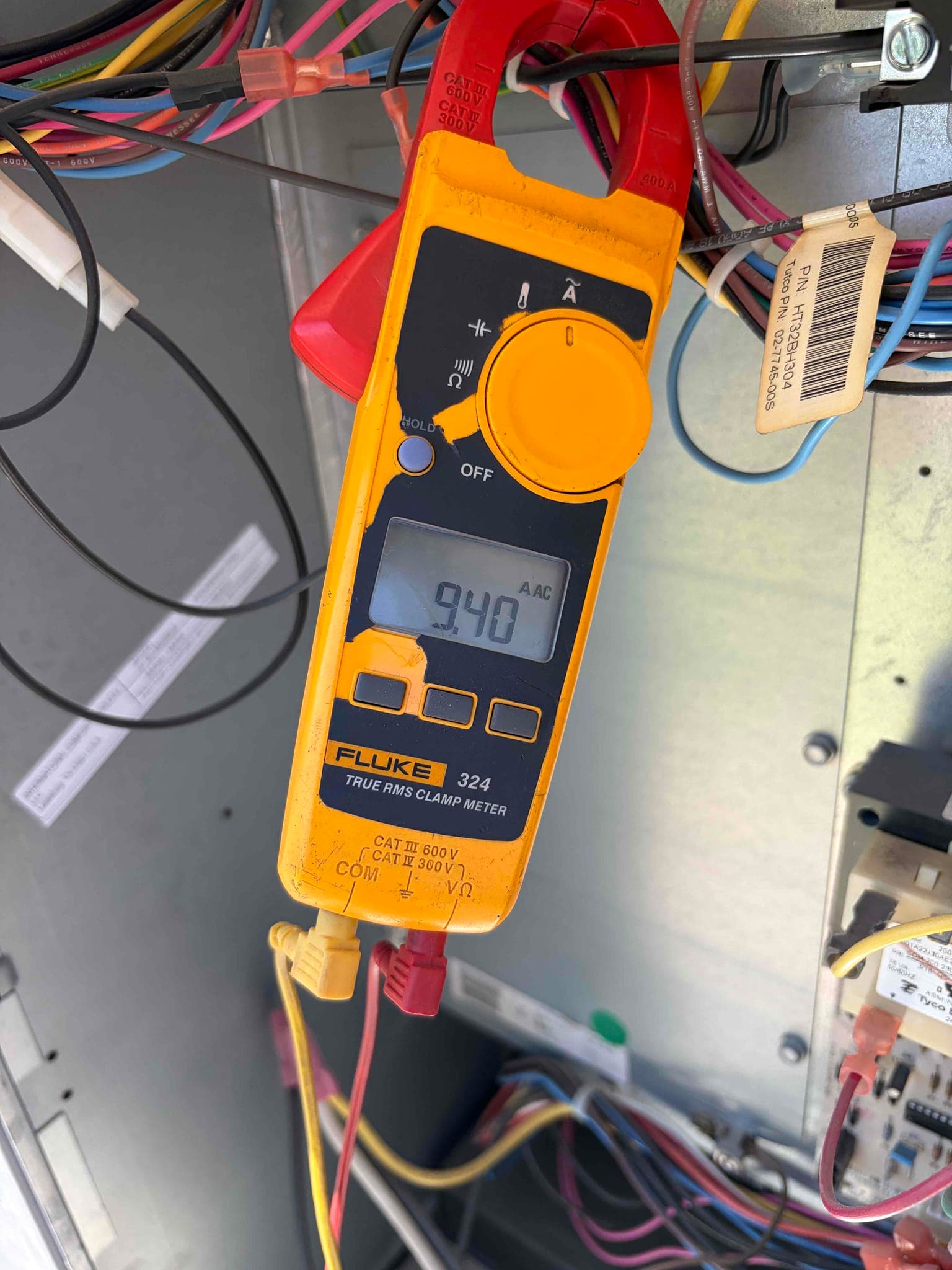 Diagnostic instrument display shows 9.4 A.