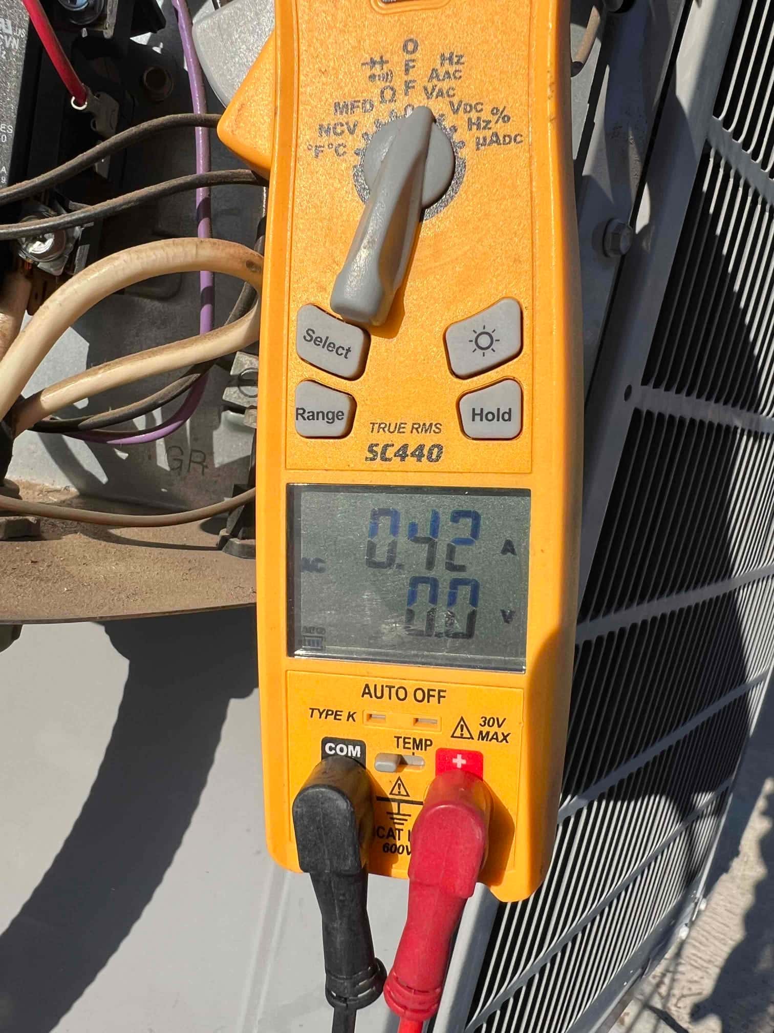 HVAC diagnostic instrument photographed during the service visit.