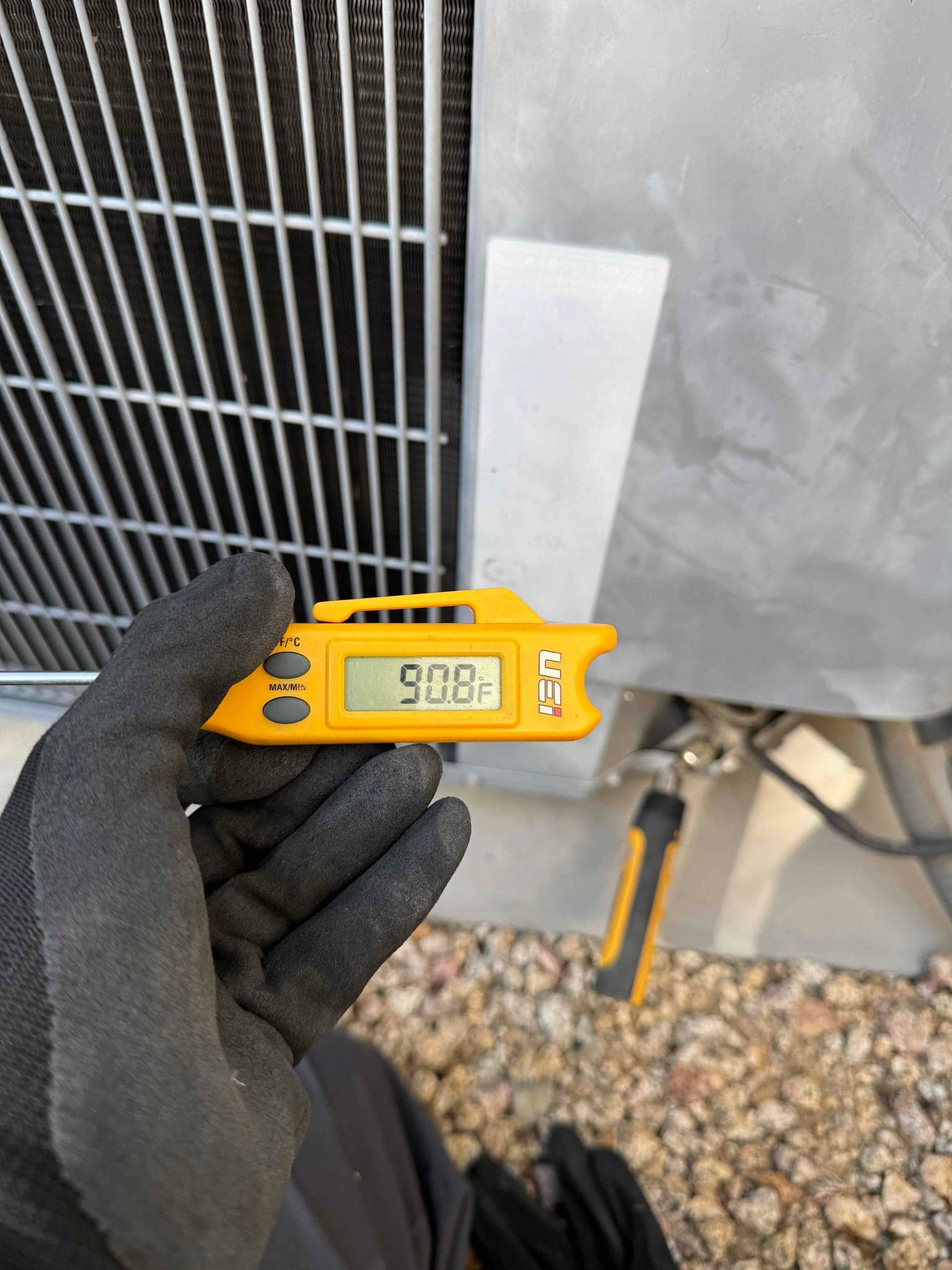 HVAC diagnostic instrument photographed during the service visit.