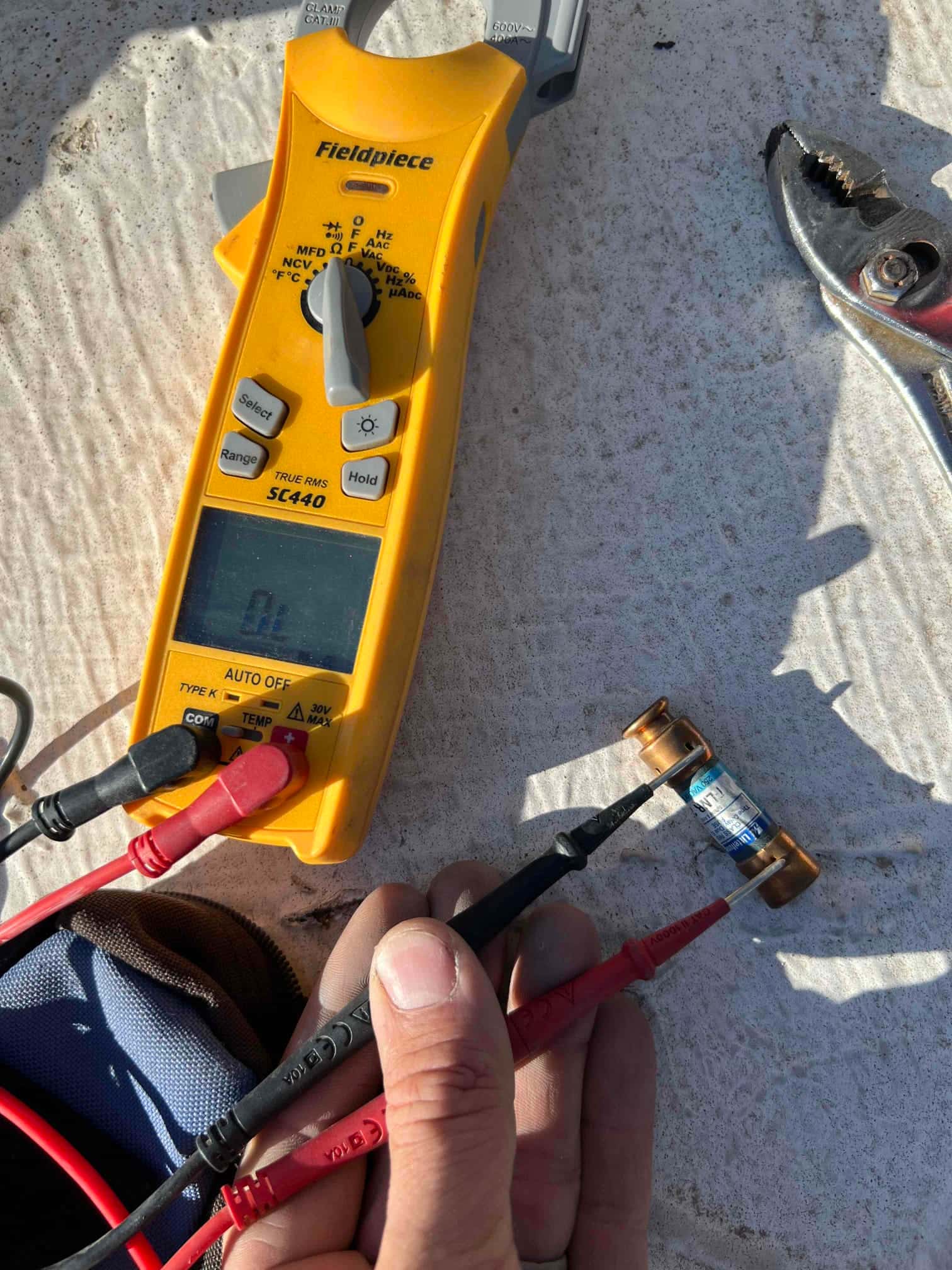 HVAC diagnostic instrument photographed during the service visit.