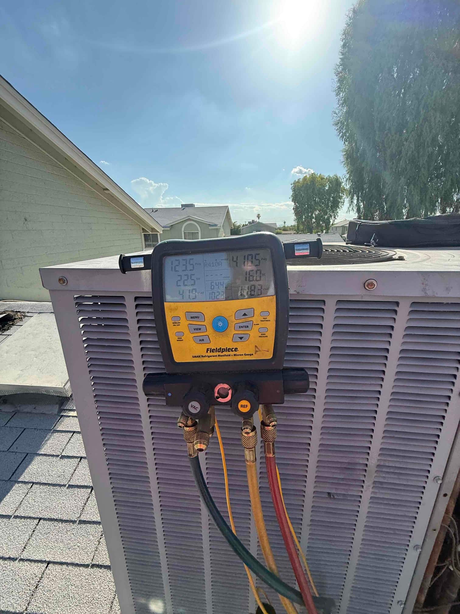 HVAC diagnostic instrument photographed during the service visit.