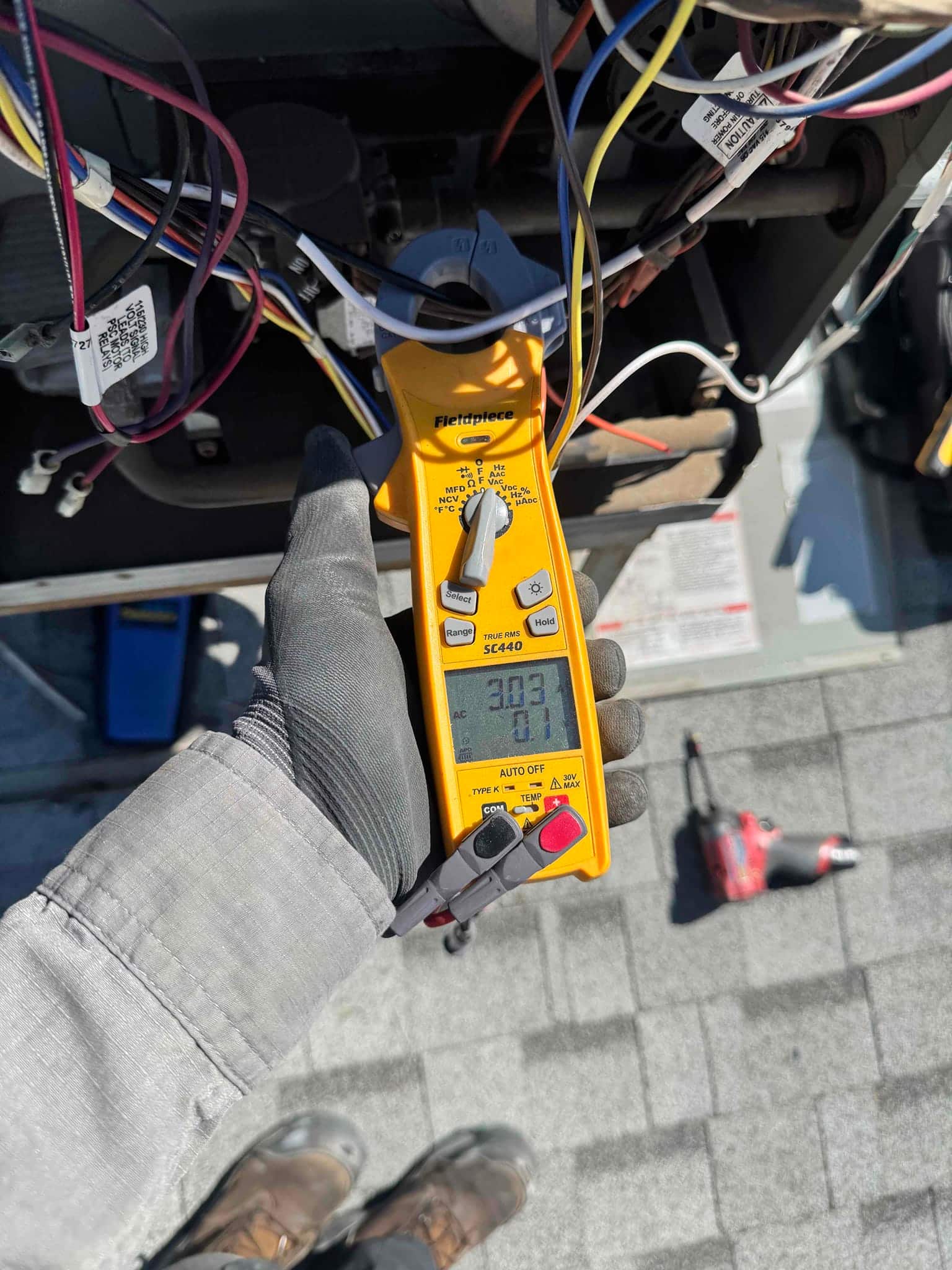 HVAC diagnostic instrument photographed during the service visit.