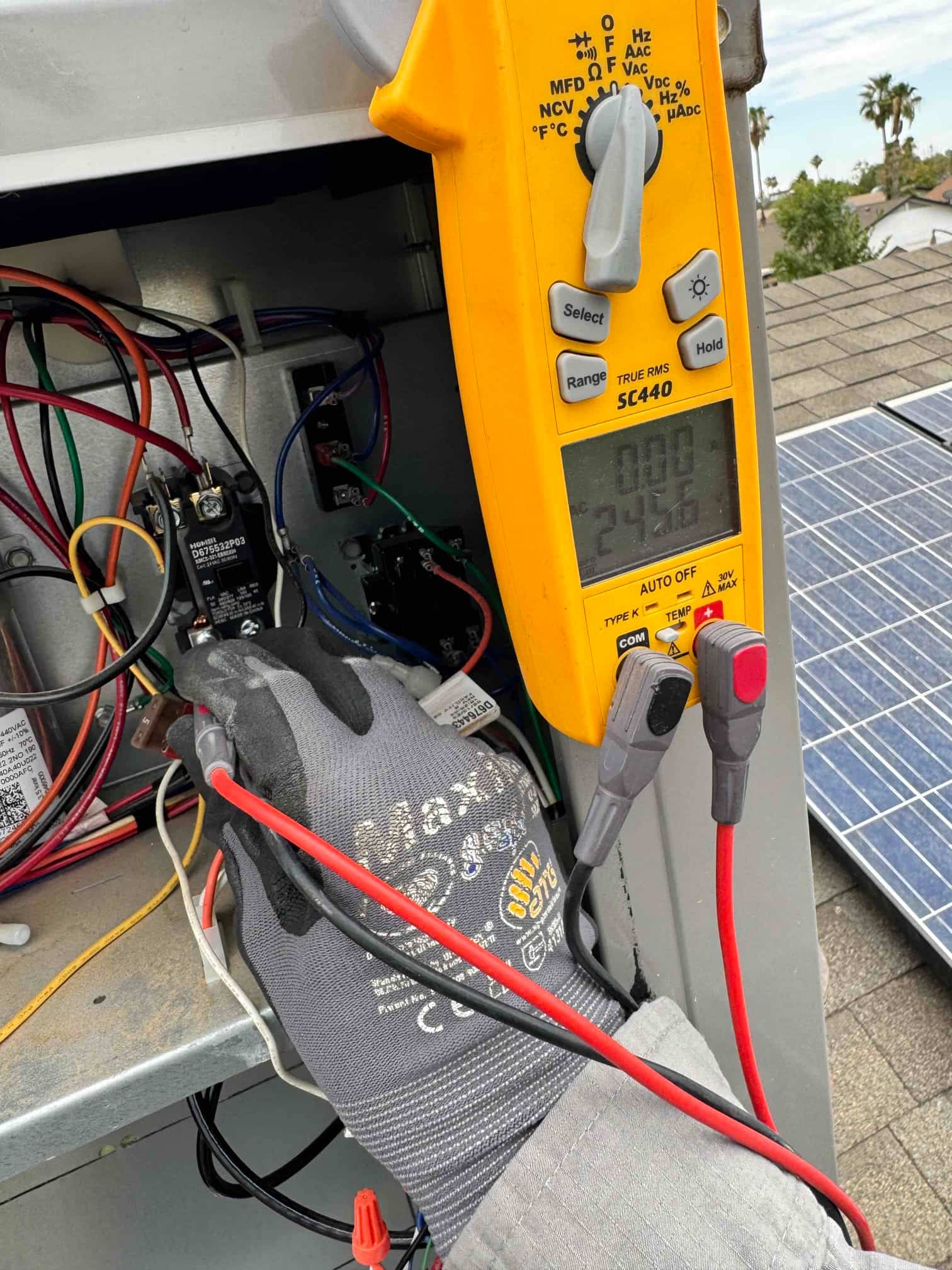 HVAC diagnostic instrument photographed during the service visit.