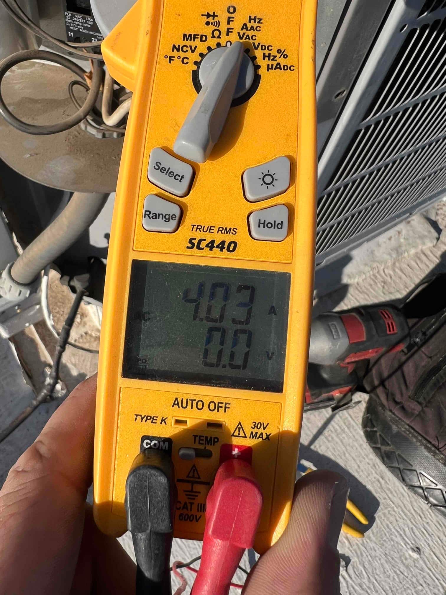 HVAC diagnostic instrument photographed during the service visit.