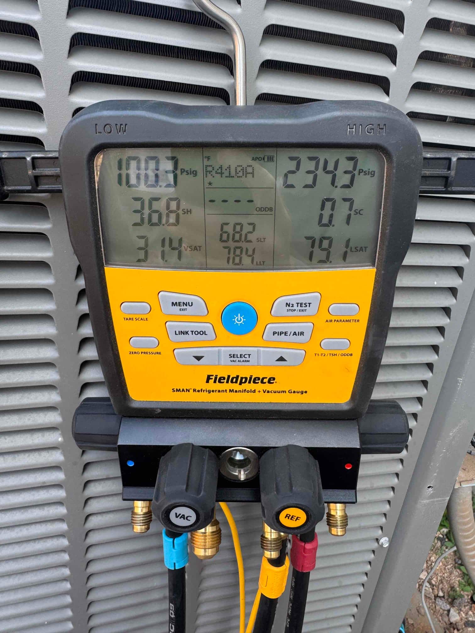 HVAC diagnostic instrument photographed during the service visit.