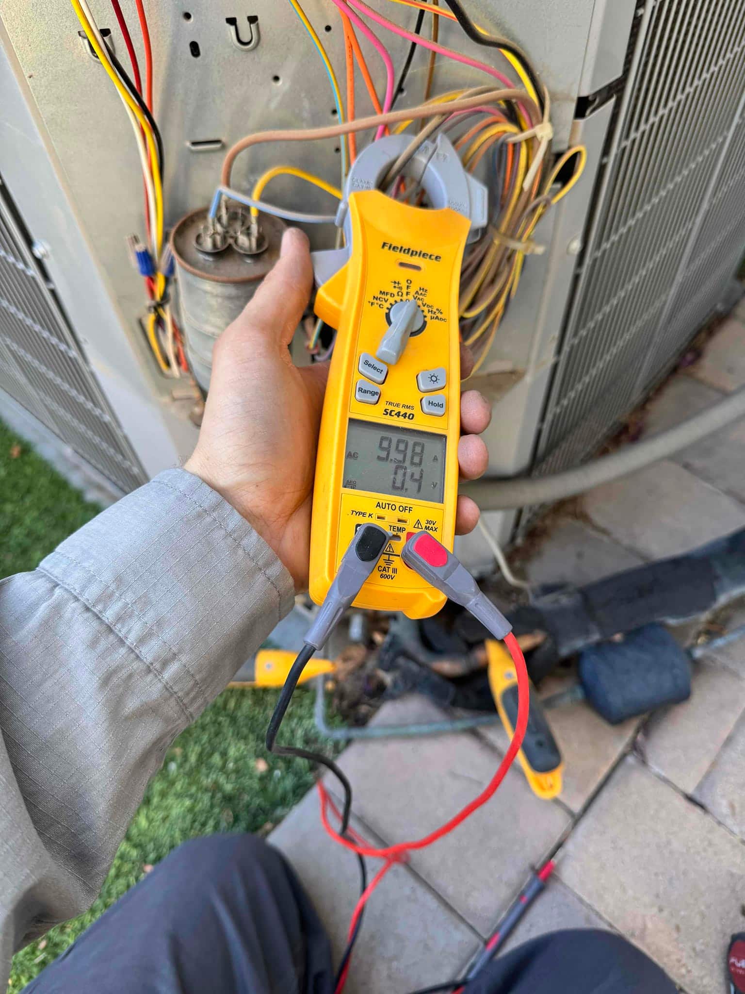 HVAC diagnostic instrument photographed during the service visit.
