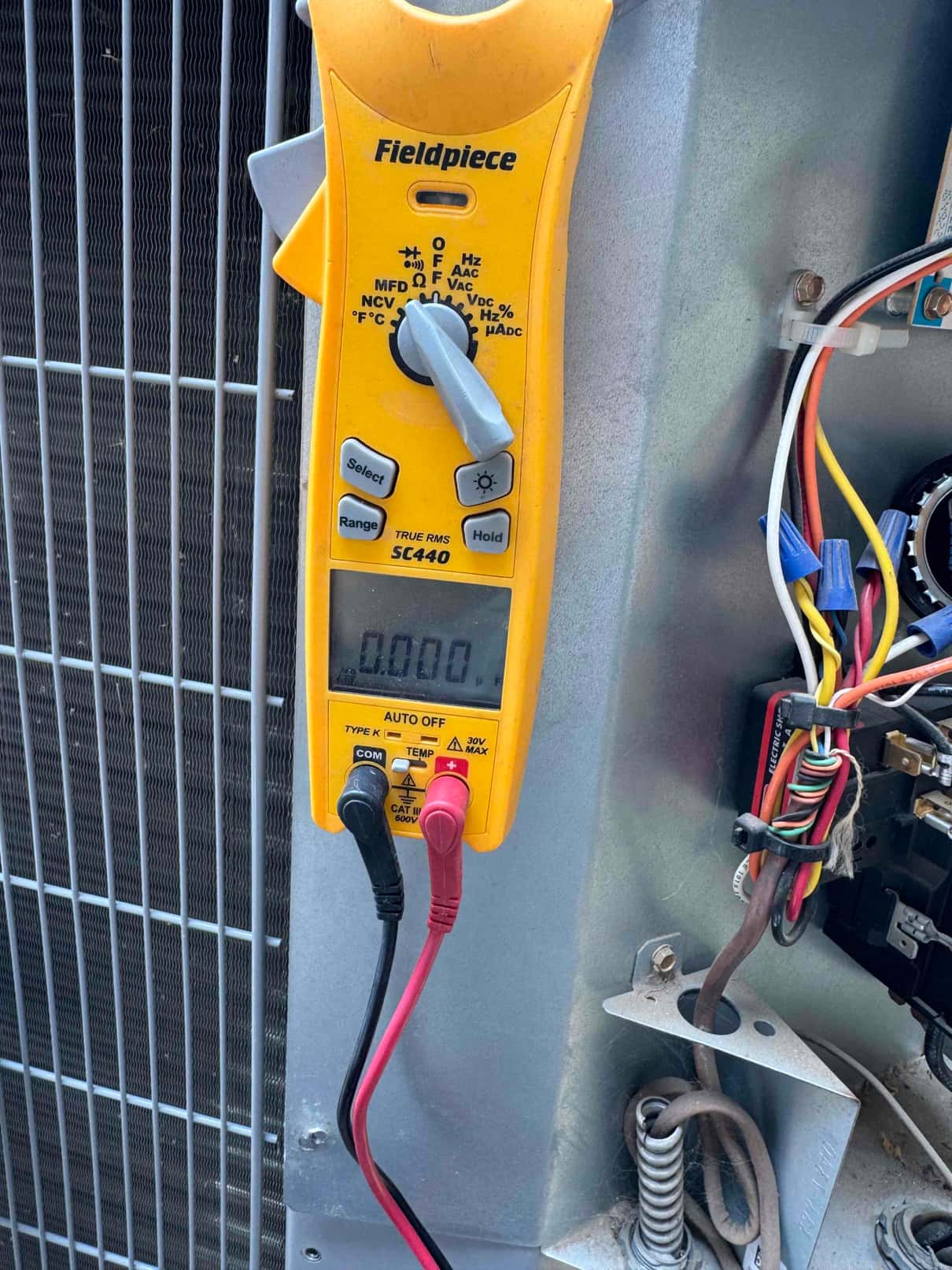 HVAC diagnostic instrument photographed during the service visit.