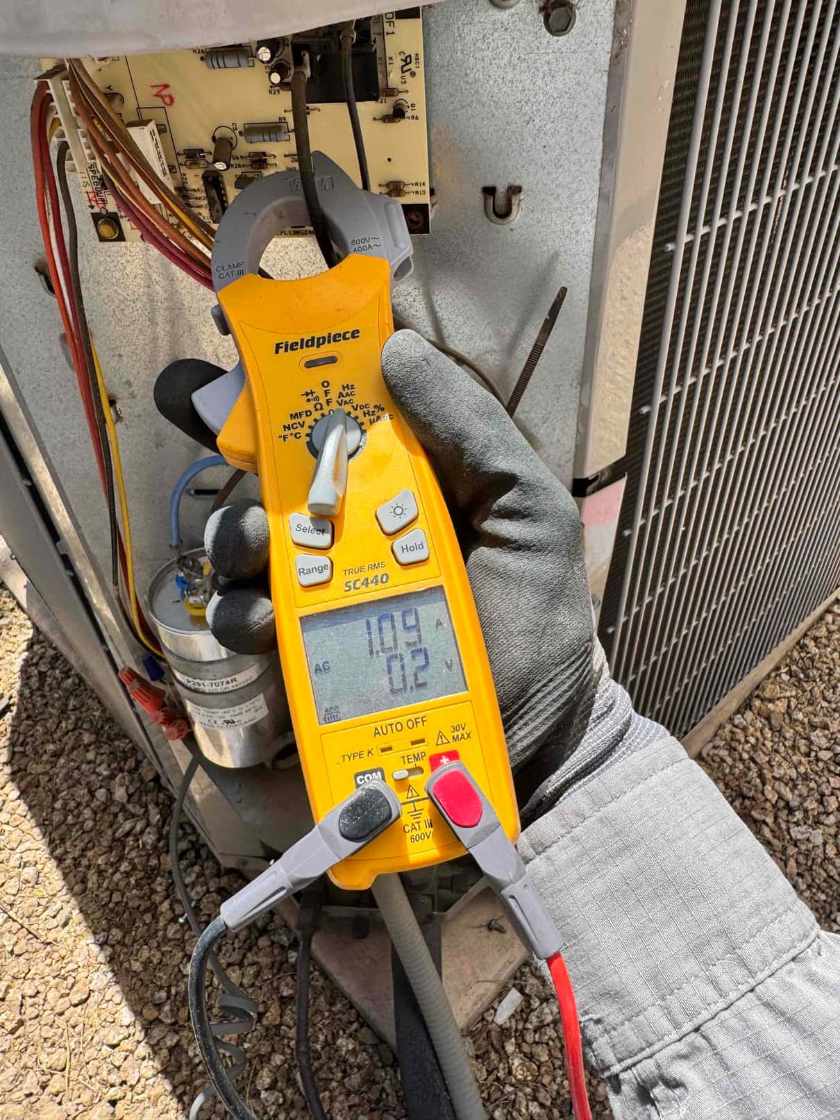 HVAC diagnostic instrument photographed during the service visit.