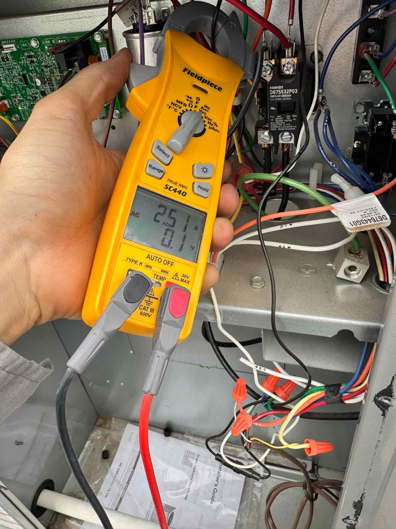 HVAC diagnostic instrument photographed during the service visit.