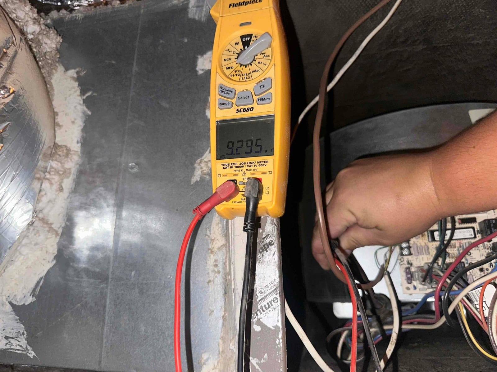 HVAC diagnostic instrument photographed during the service visit.