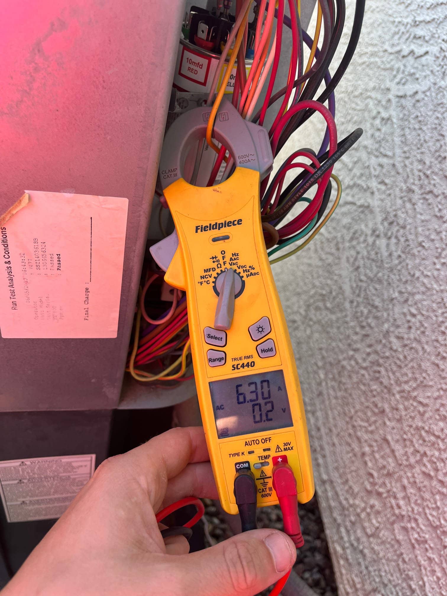 HVAC diagnostic instrument photographed during the service visit.