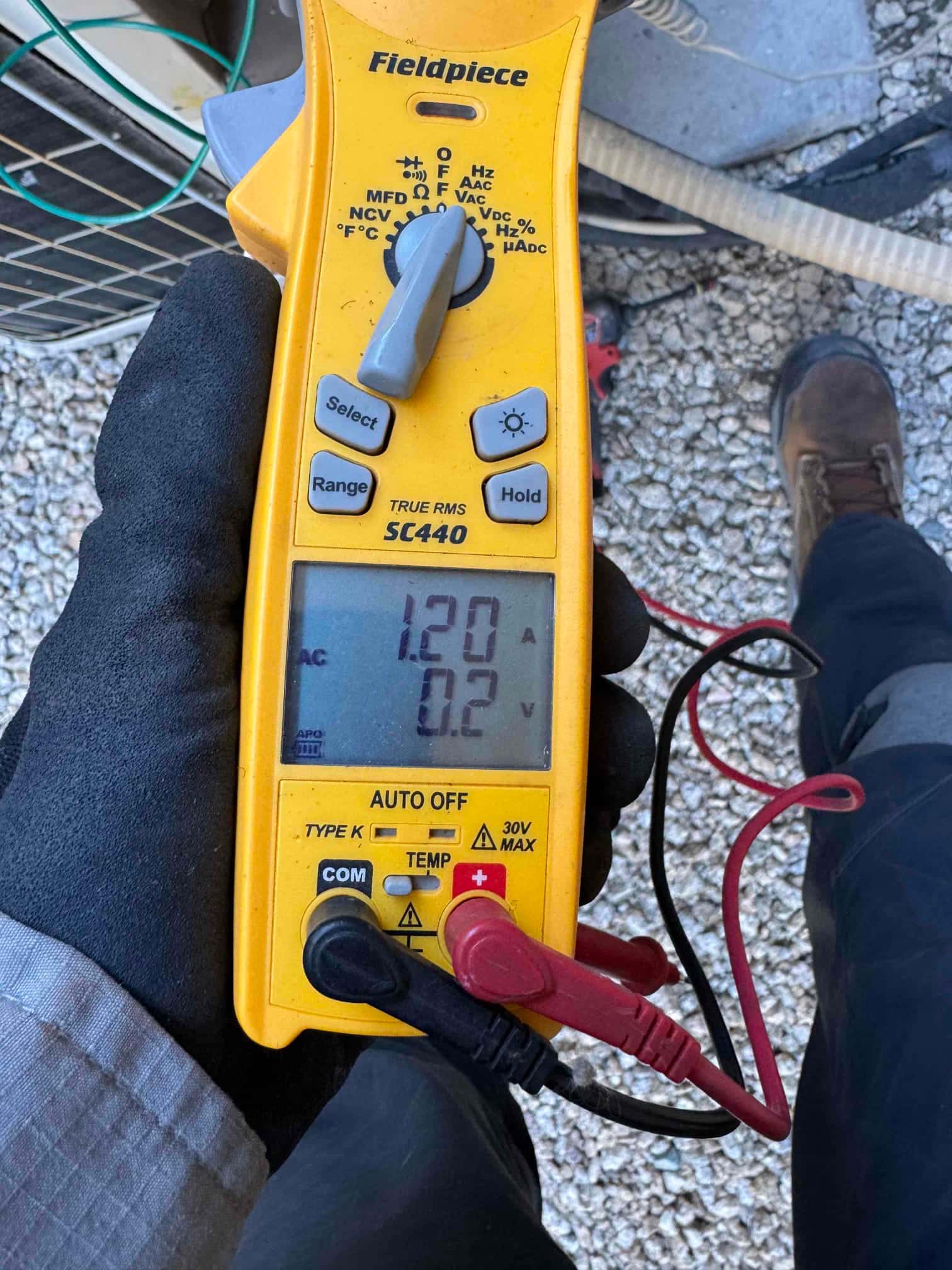 HVAC diagnostic instrument photographed during the service visit.