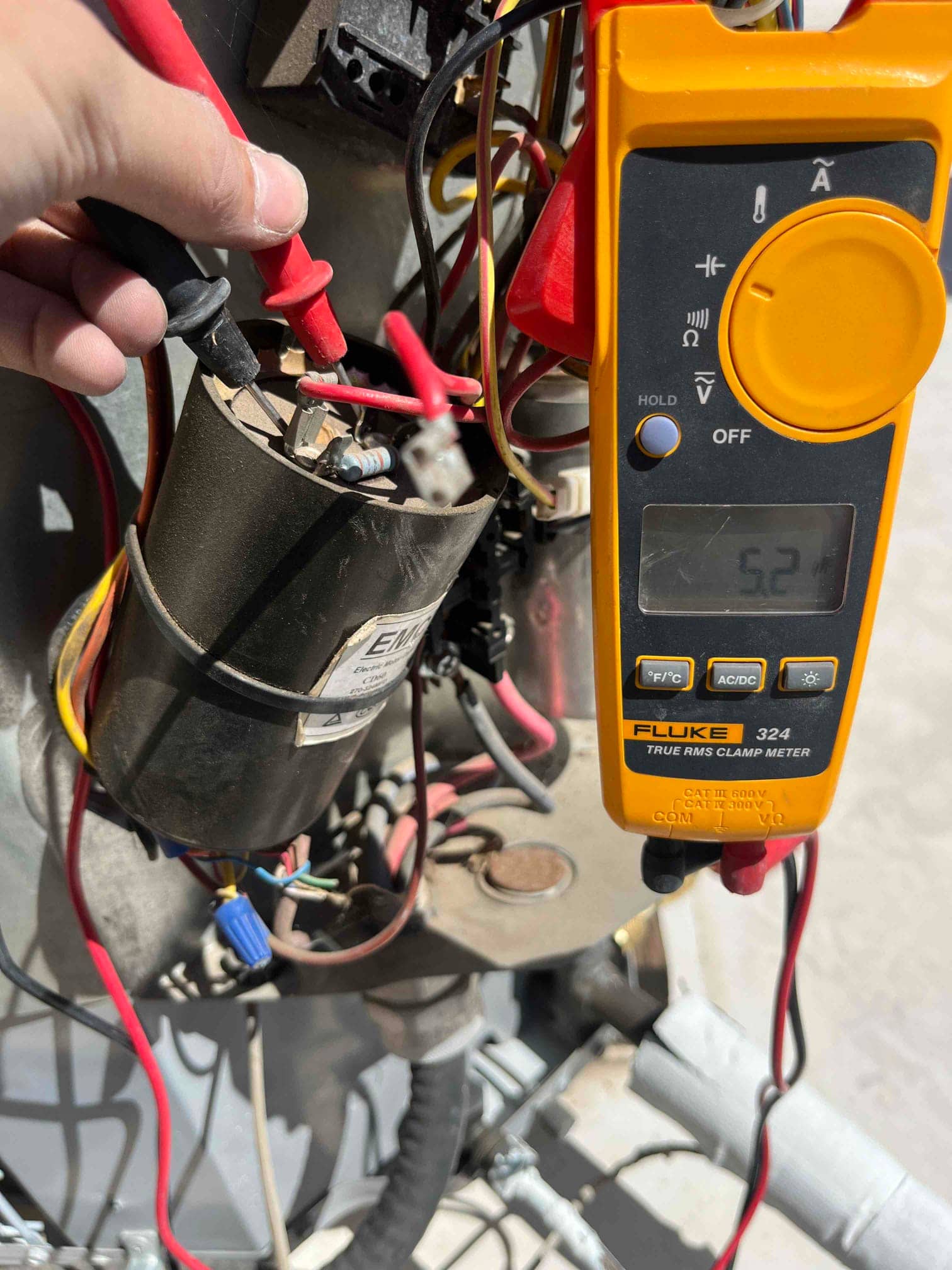 HVAC diagnostic instrument photographed during the service visit.