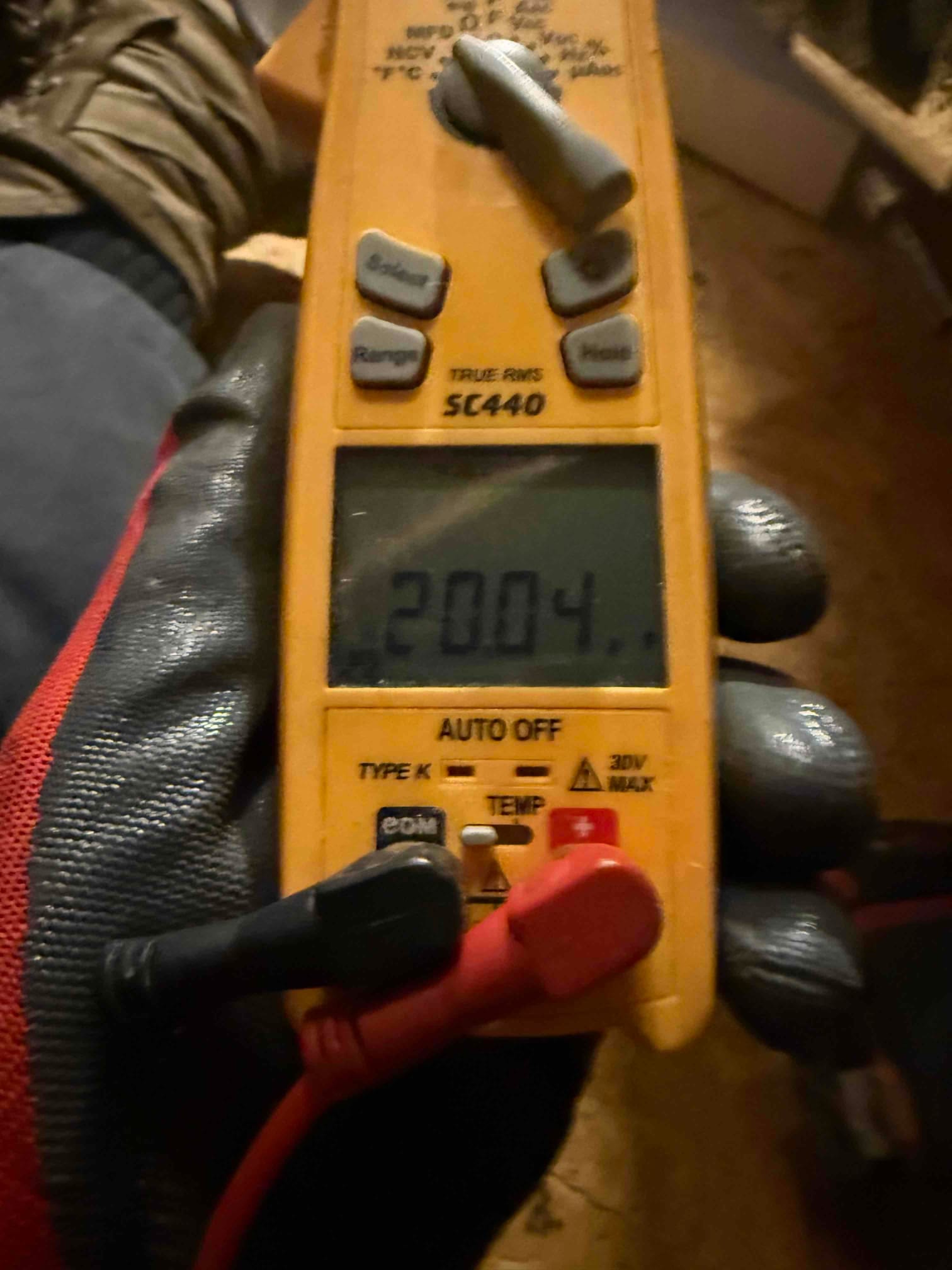 HVAC diagnostic instrument photographed during the service visit.