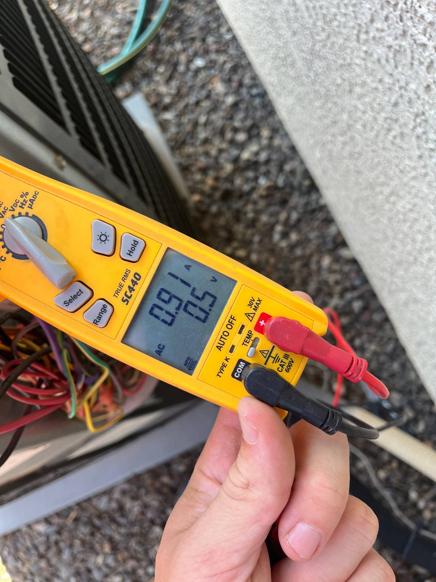 HVAC diagnostic instrument photographed during the service visit.