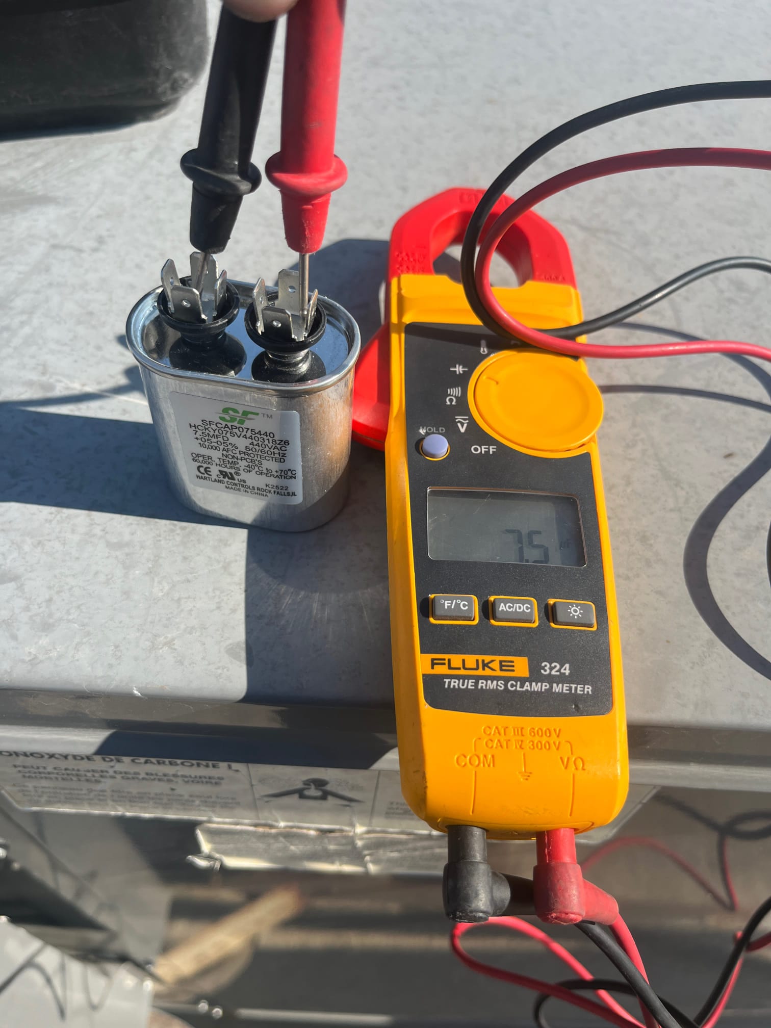 HVAC diagnostic instrument photographed during the service visit.