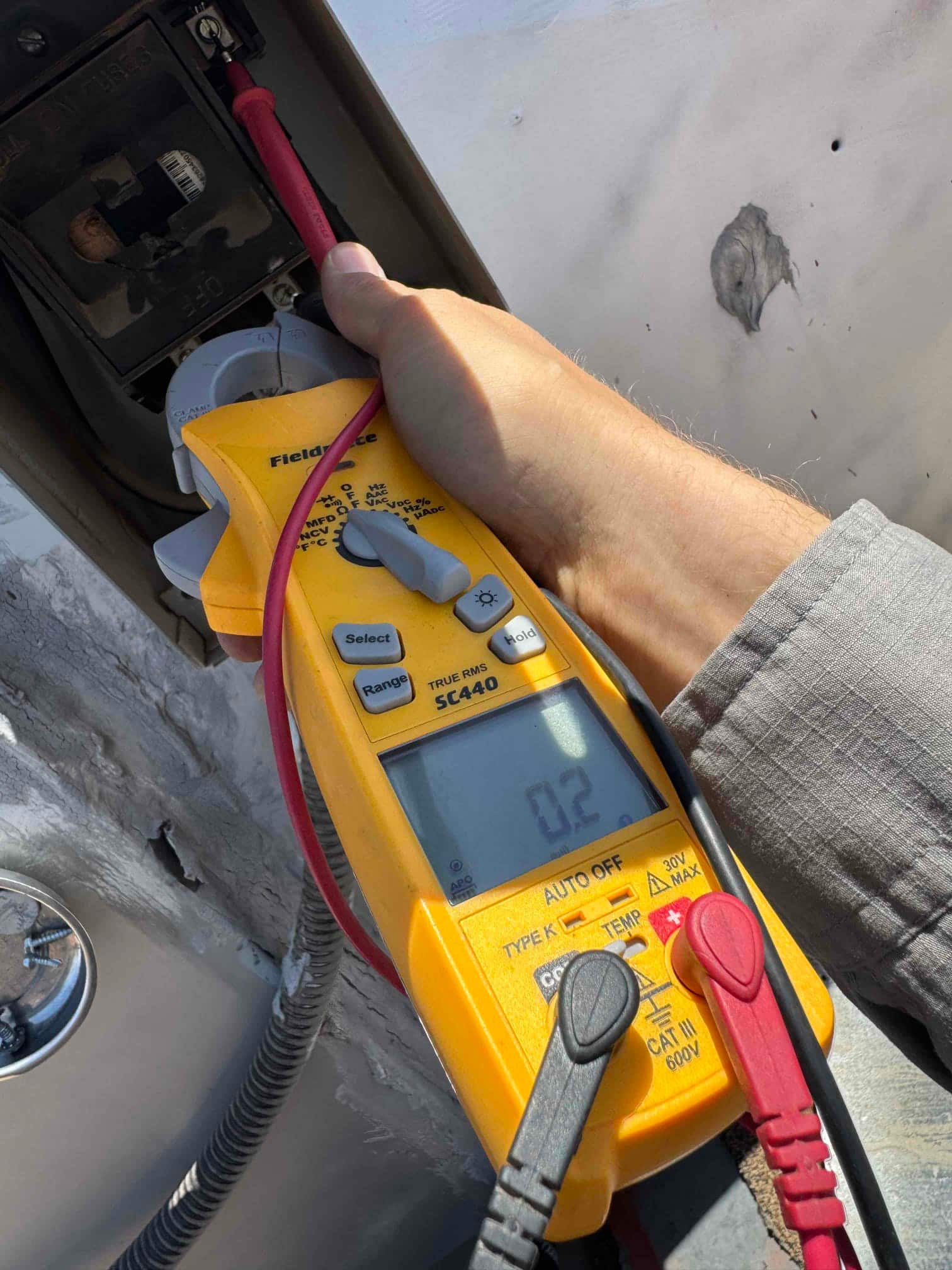 HVAC diagnostic instrument photographed during the service visit.