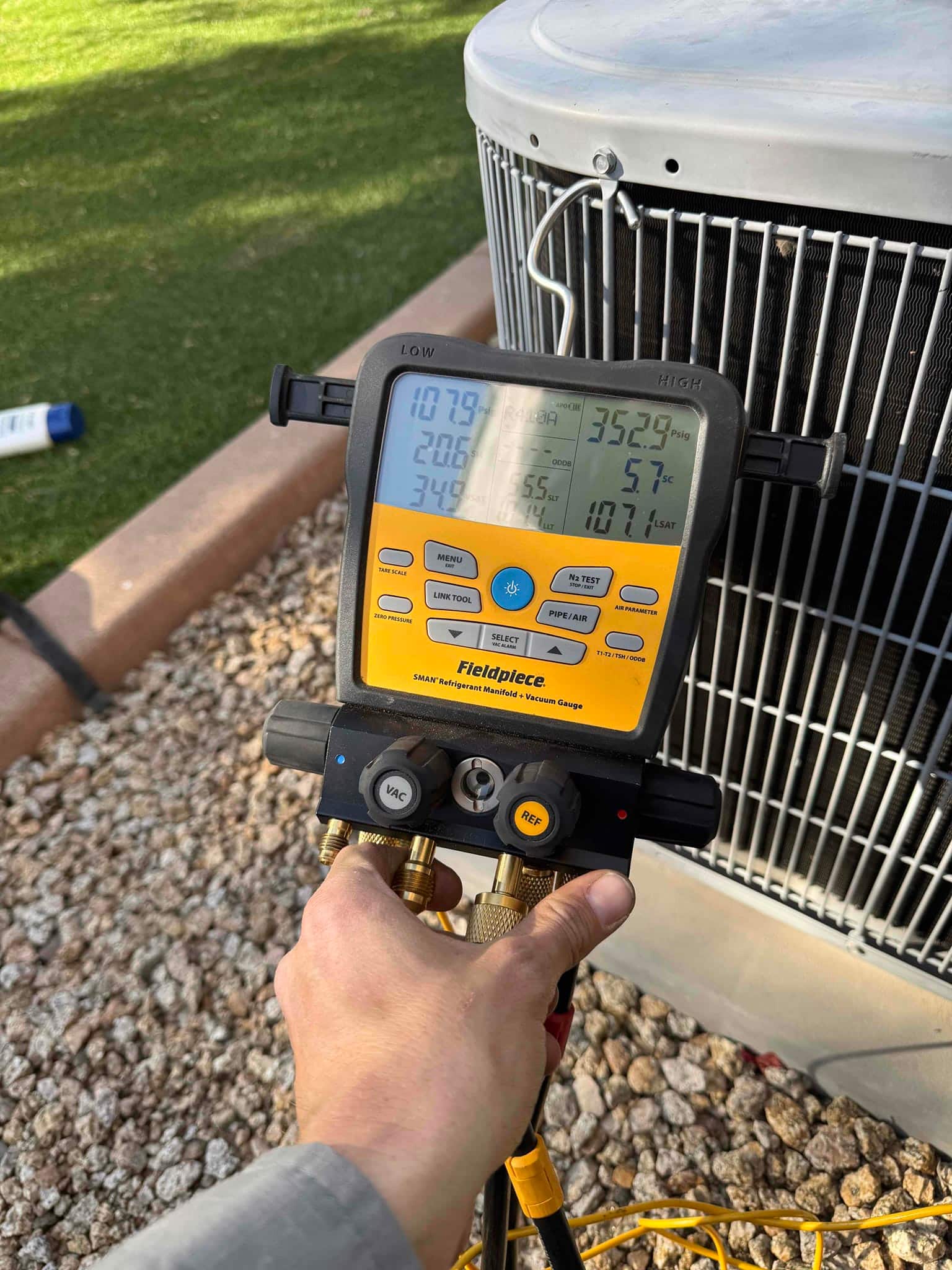 HVAC diagnostic instrument photographed during the service visit.