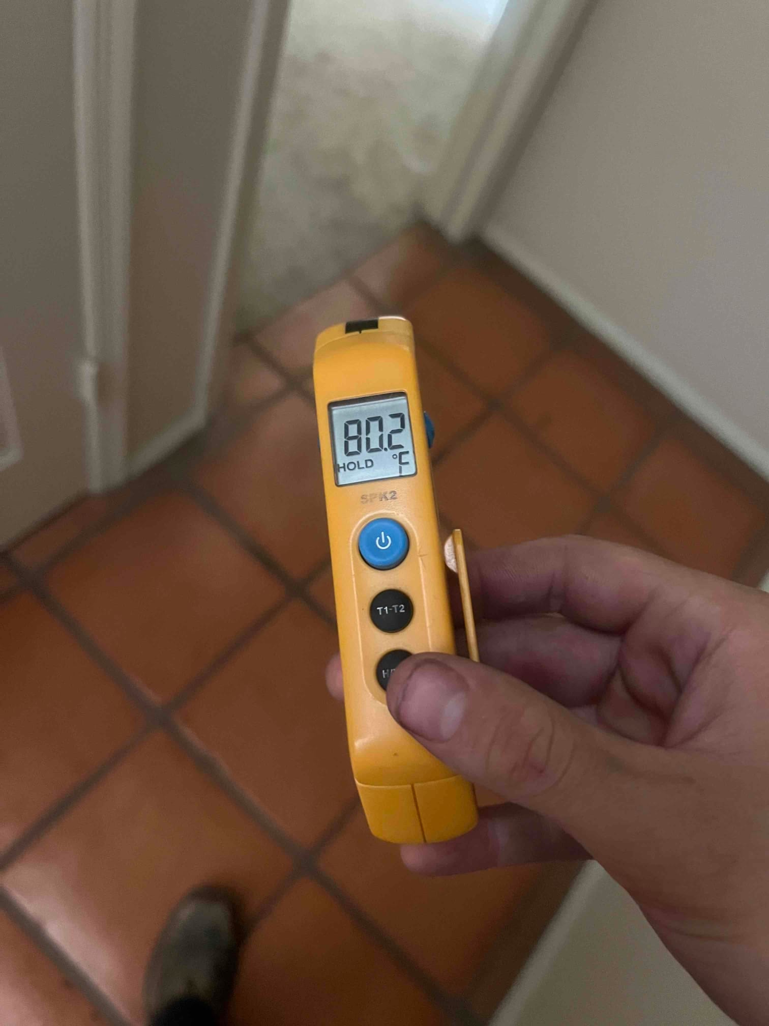 HVAC diagnostic instrument photographed during the service visit.