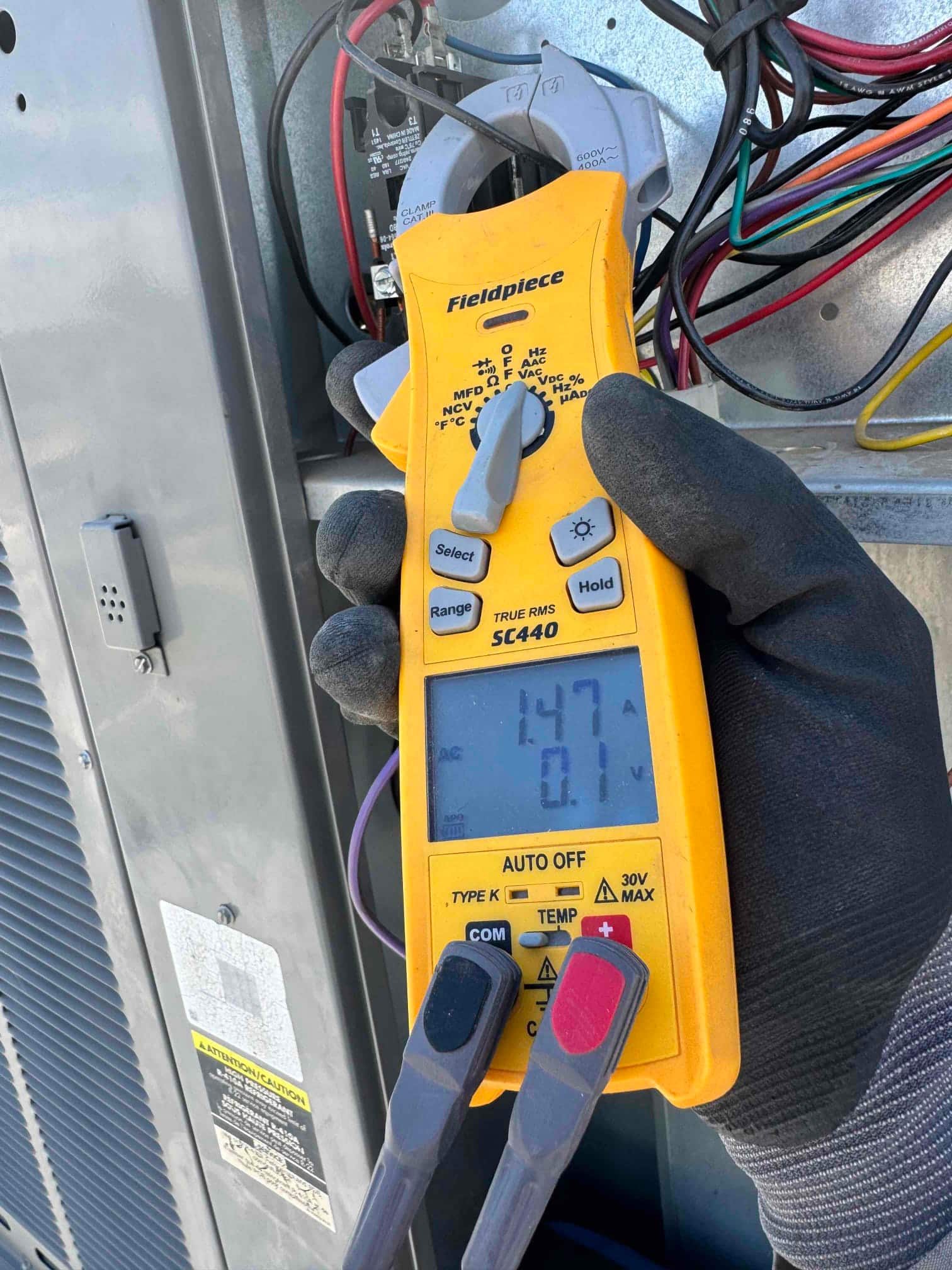HVAC diagnostic instrument photographed during the service visit.