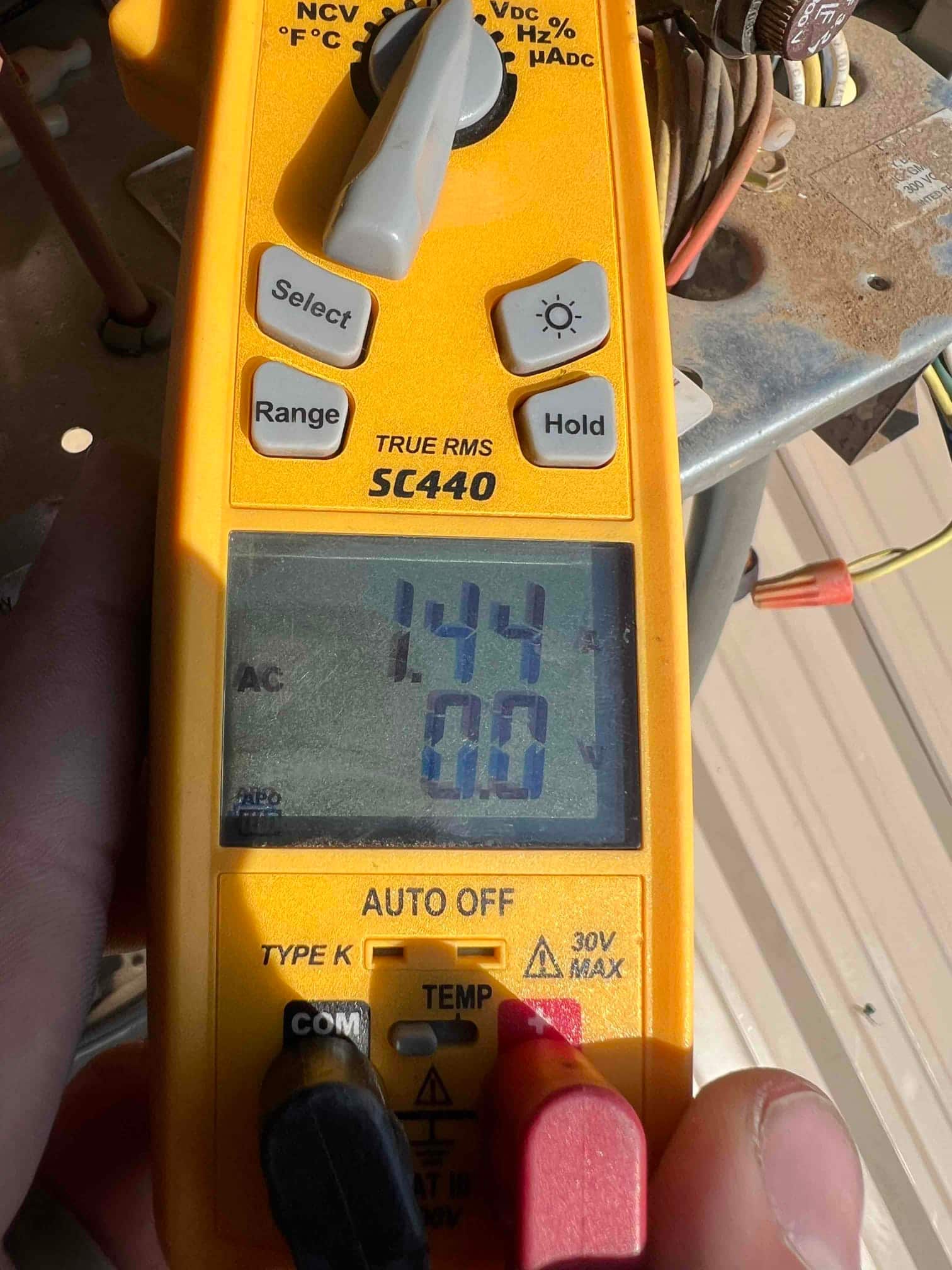 HVAC diagnostic instrument photographed during the service visit.
