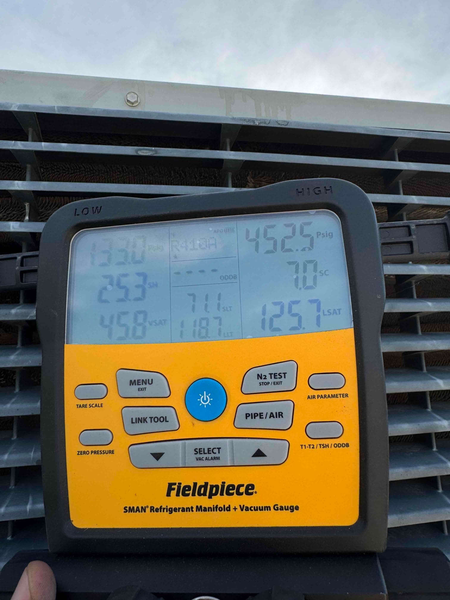 HVAC diagnostic instrument photographed during the service visit.