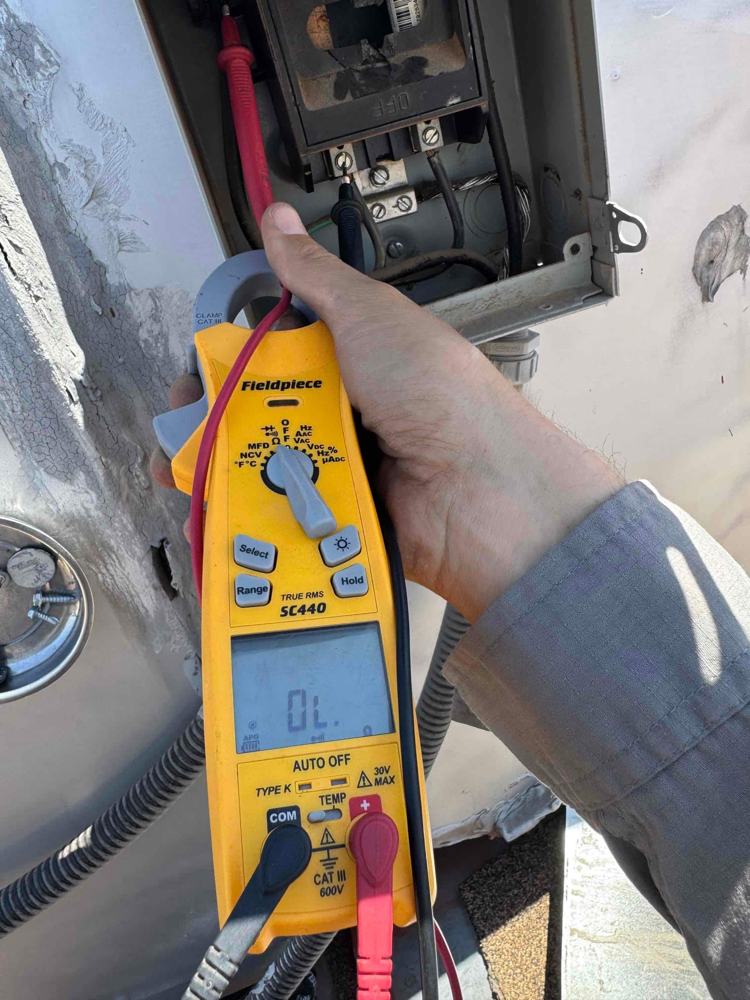 HVAC diagnostic instrument photographed during the service visit.
