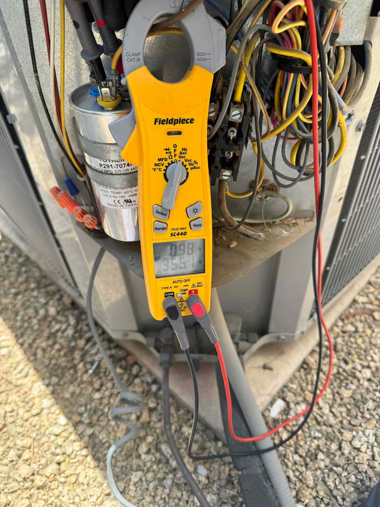 HVAC diagnostic instrument photographed during the service visit.