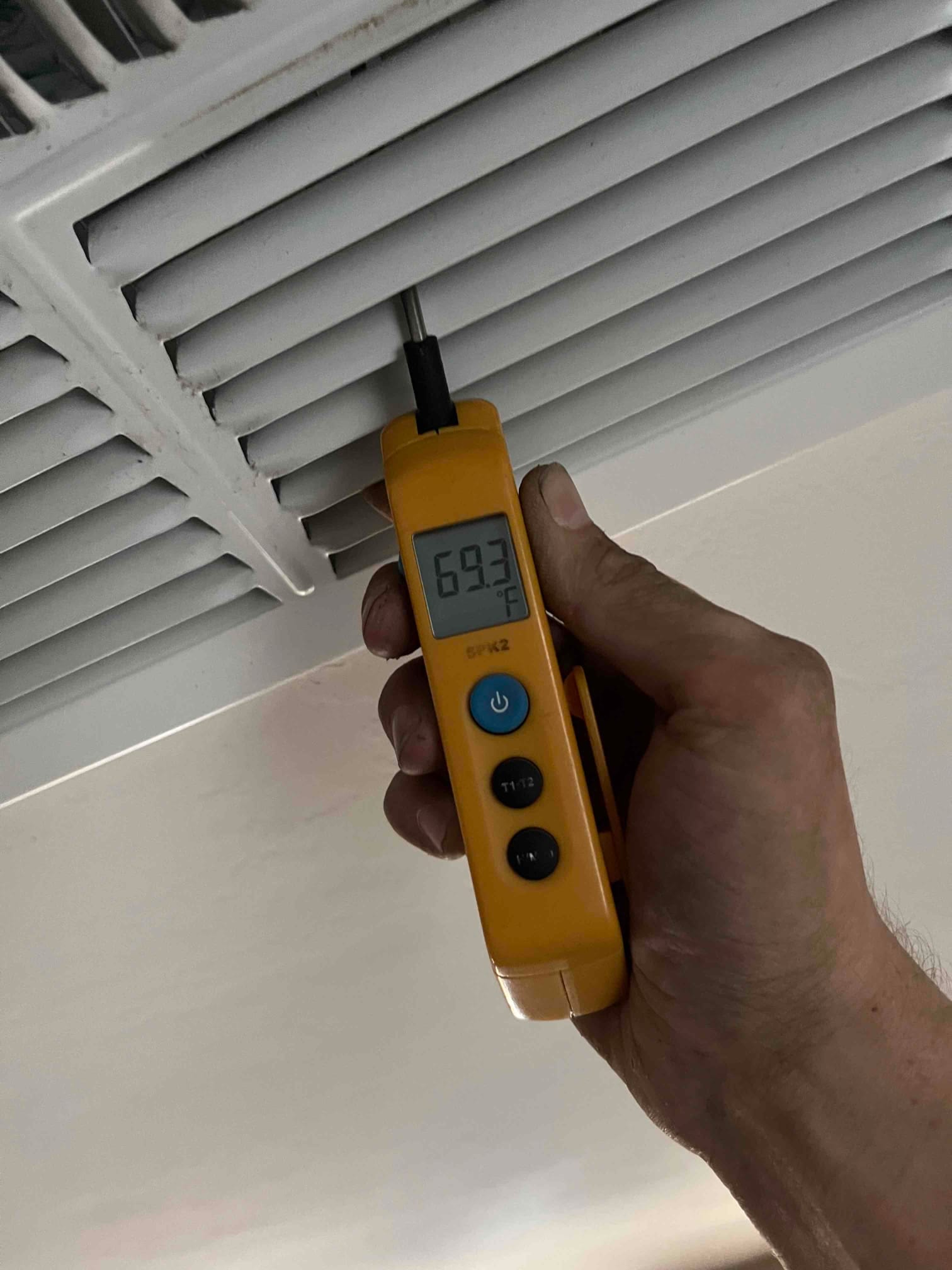 HVAC diagnostic instrument photographed during the service visit.