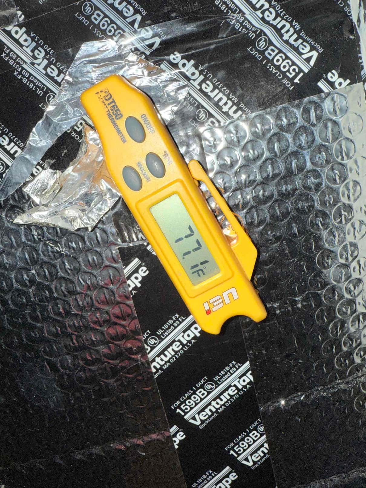 HVAC diagnostic instrument photographed during the service visit.
