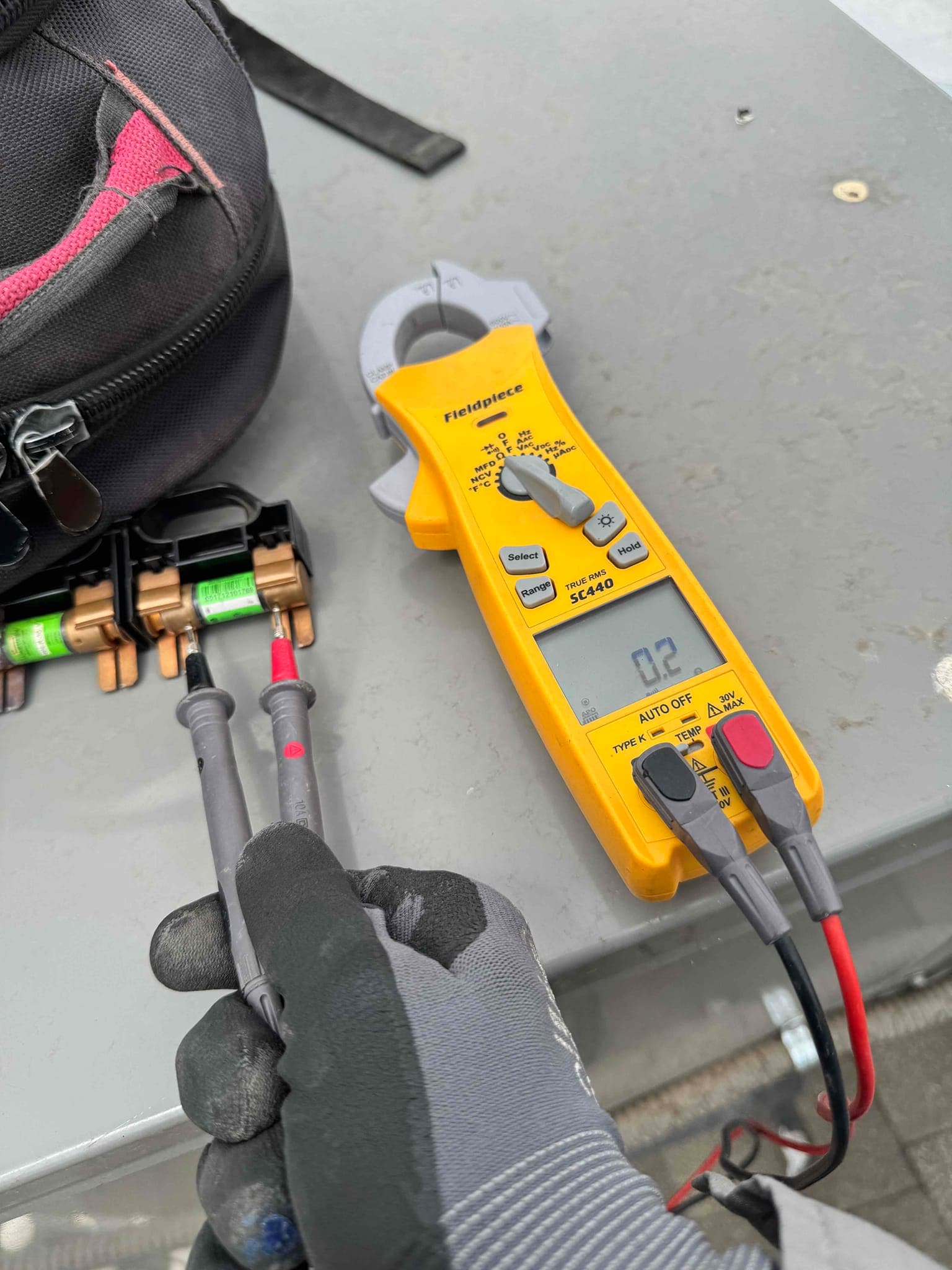 HVAC diagnostic instrument photographed during the service visit.