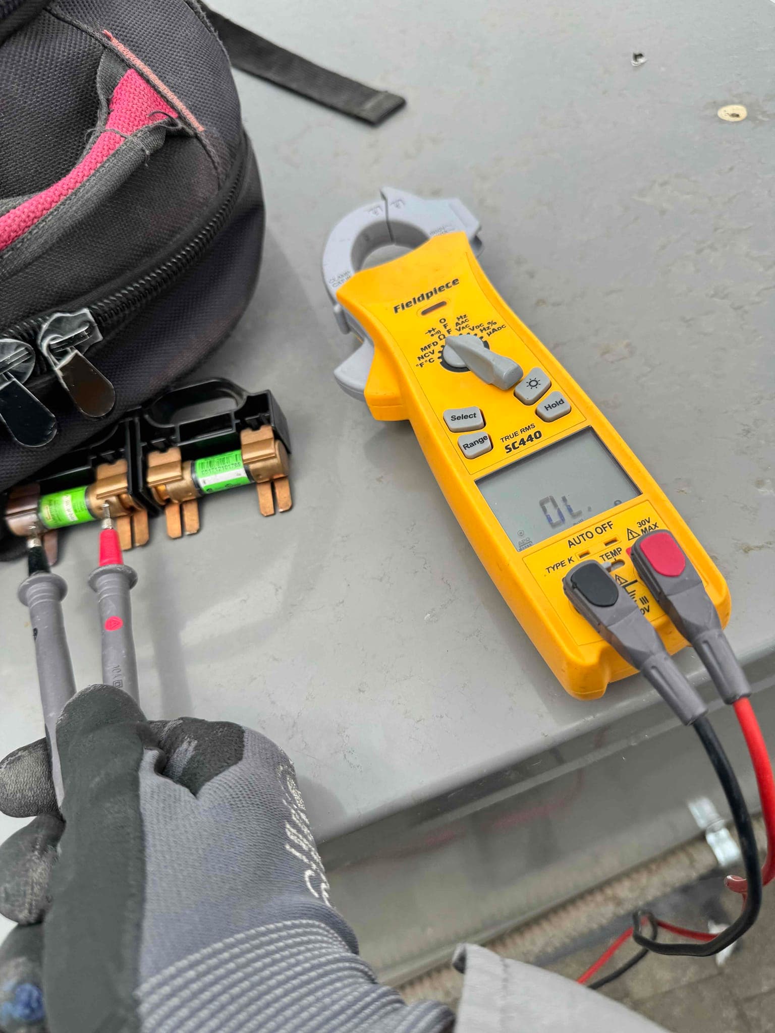 HVAC diagnostic instrument photographed during the service visit.