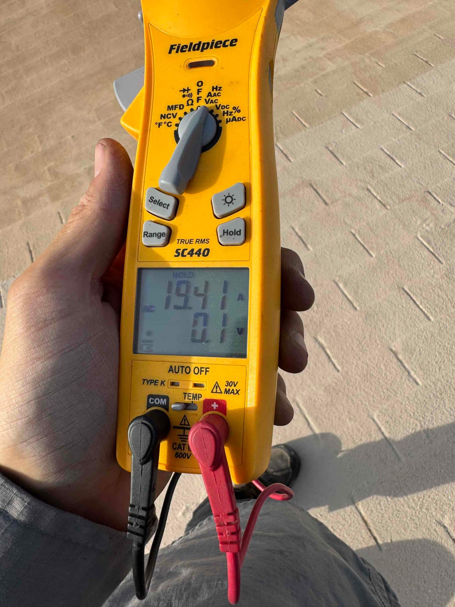 HVAC diagnostic instrument photographed during the service visit.