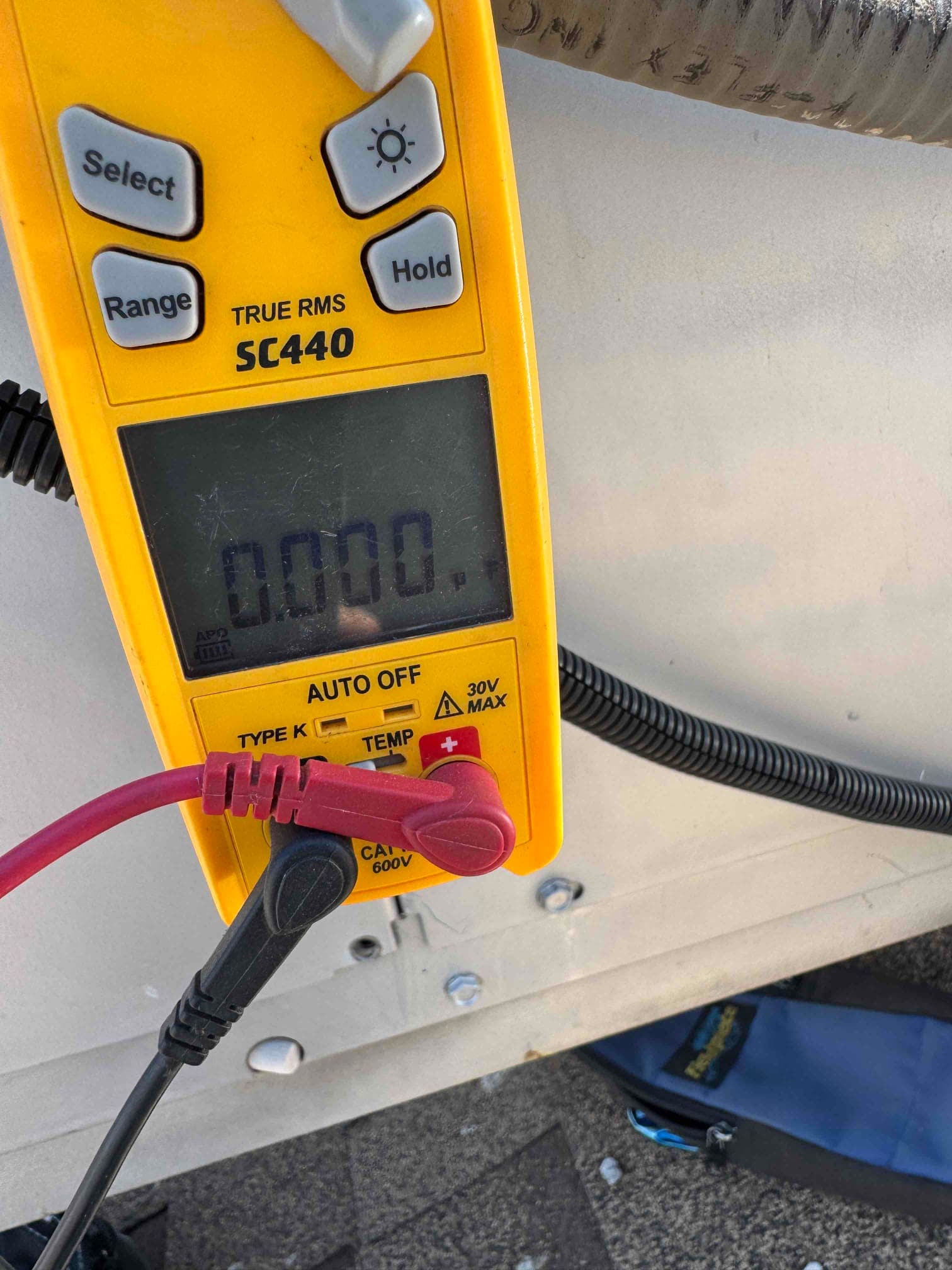 HVAC diagnostic instrument photographed during the service visit.
