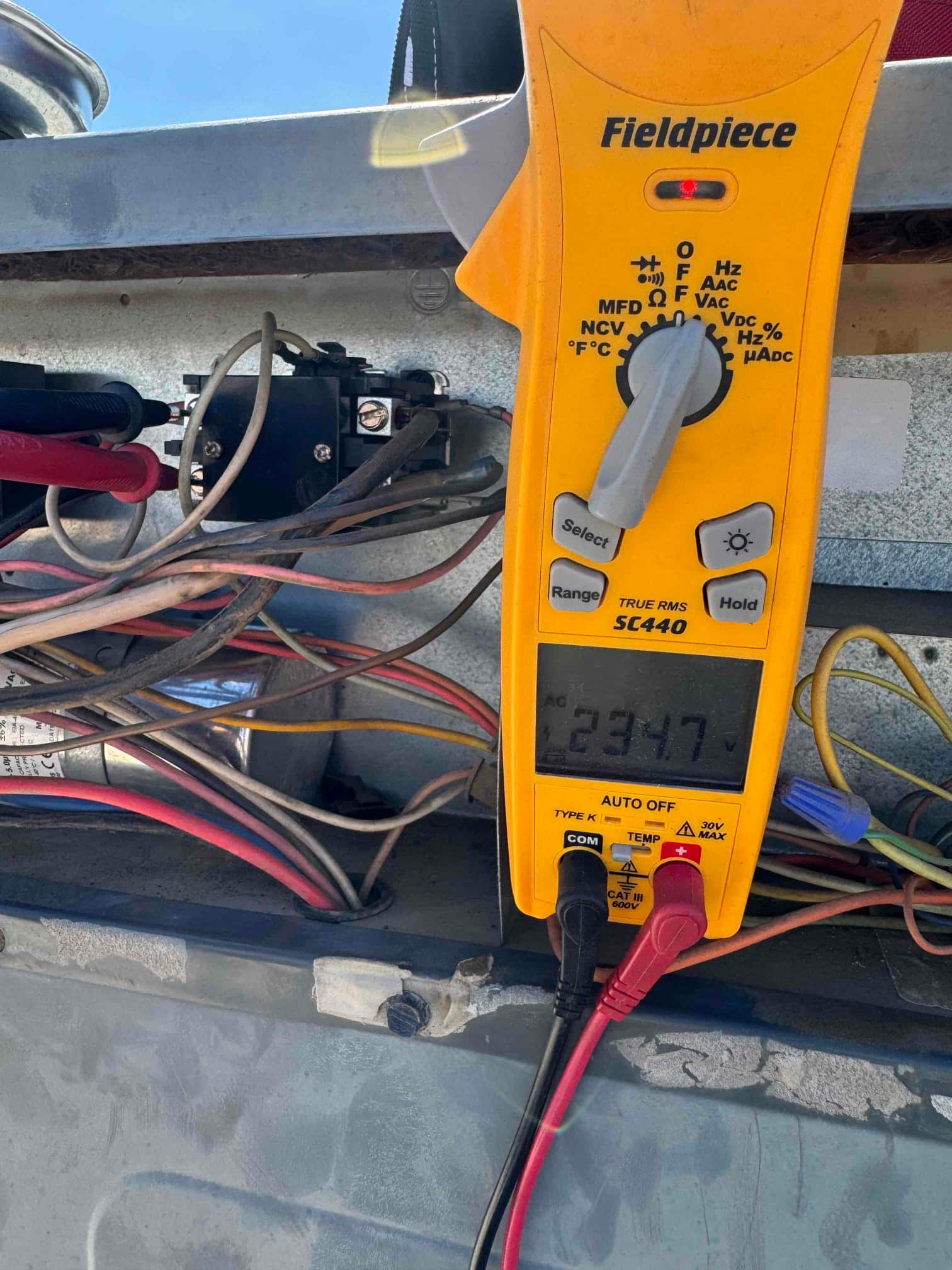 HVAC diagnostic instrument photographed during the service visit.