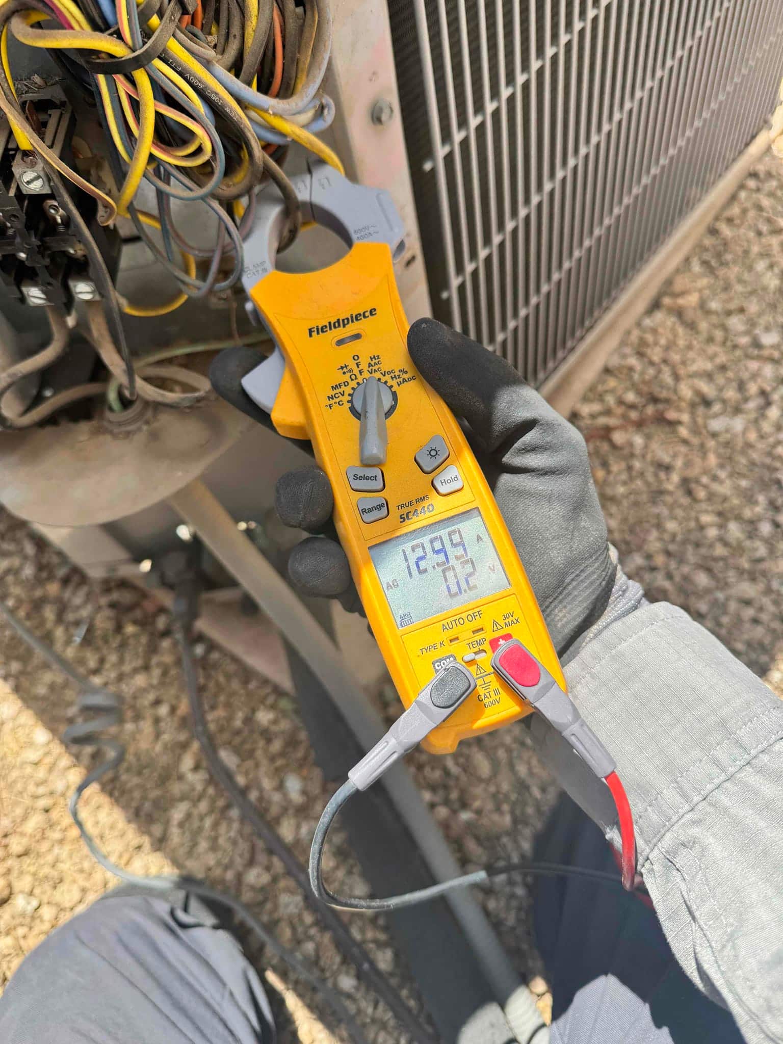 HVAC diagnostic instrument photographed during the service visit.