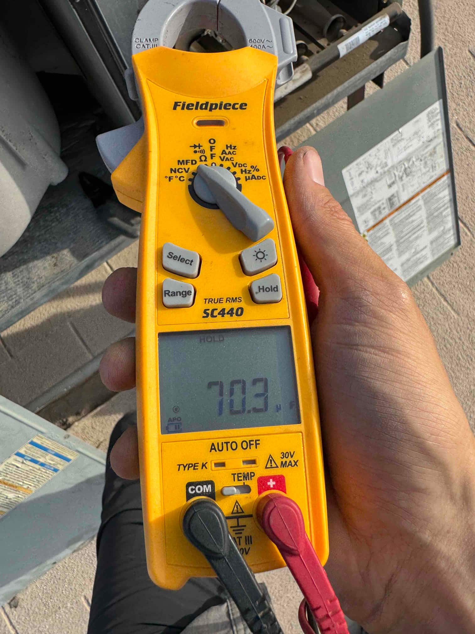 HVAC diagnostic instrument photographed during the service visit.