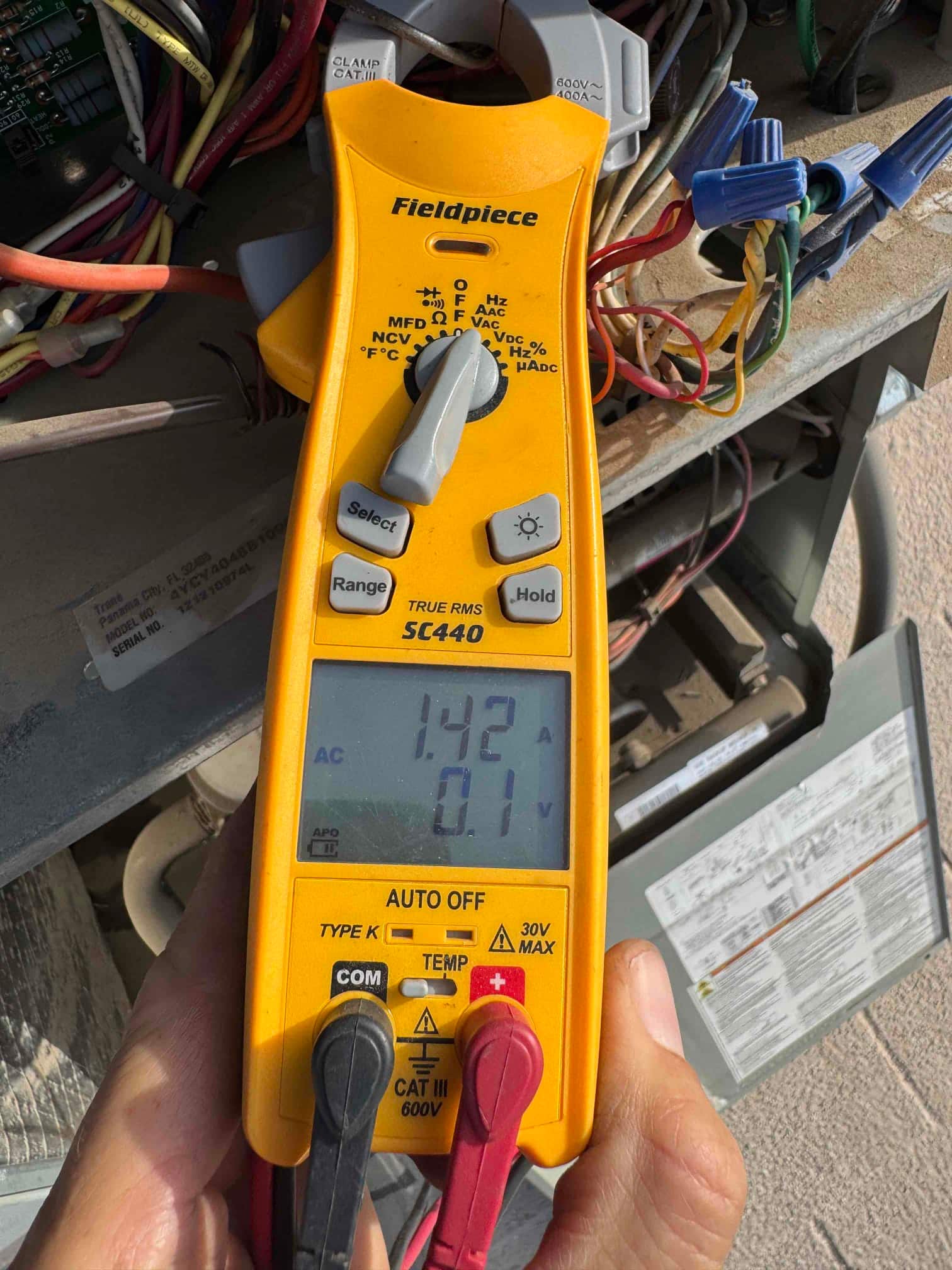 HVAC diagnostic instrument photographed during the service visit.
