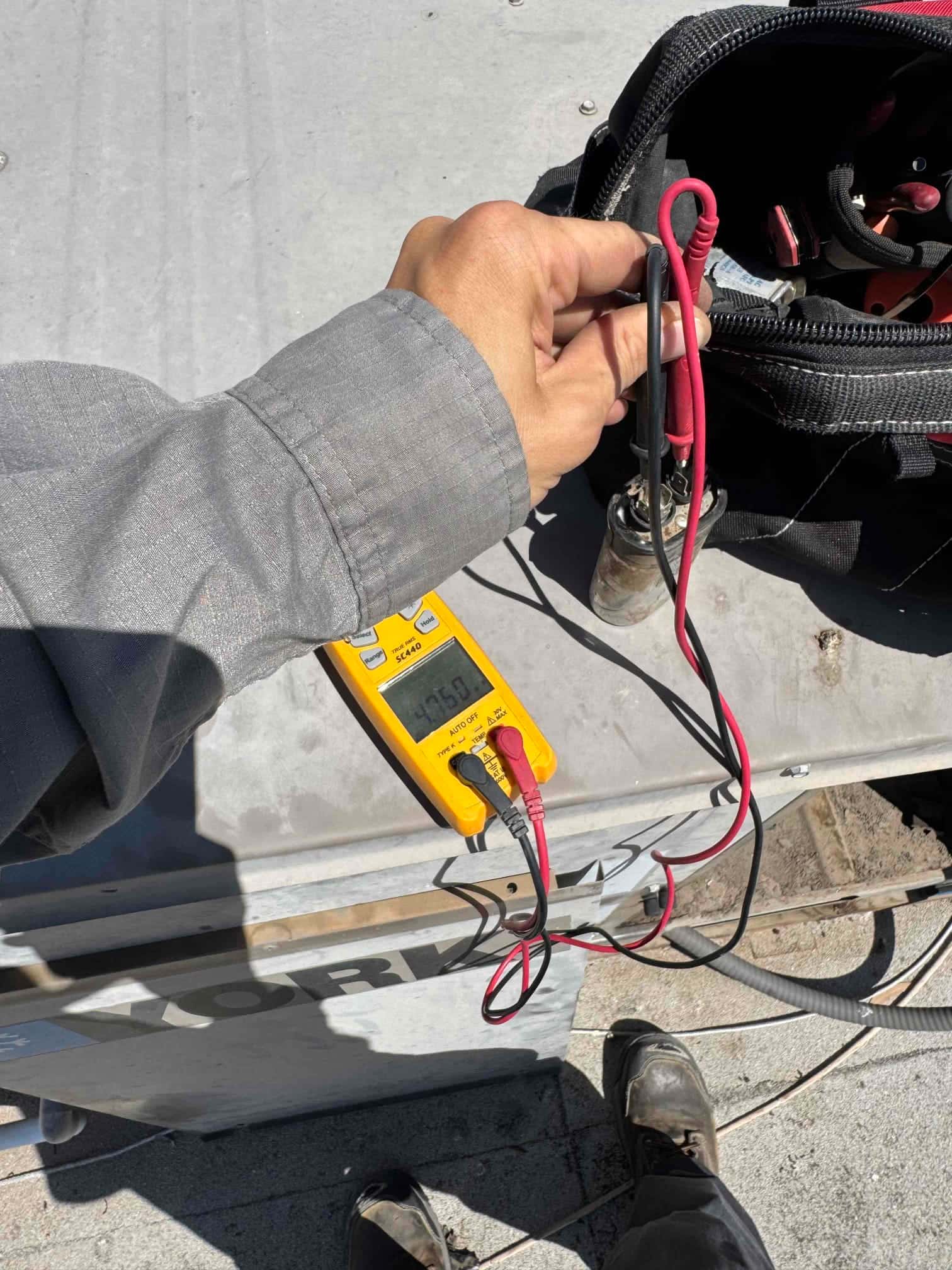 HVAC diagnostic instrument photographed during the service visit.