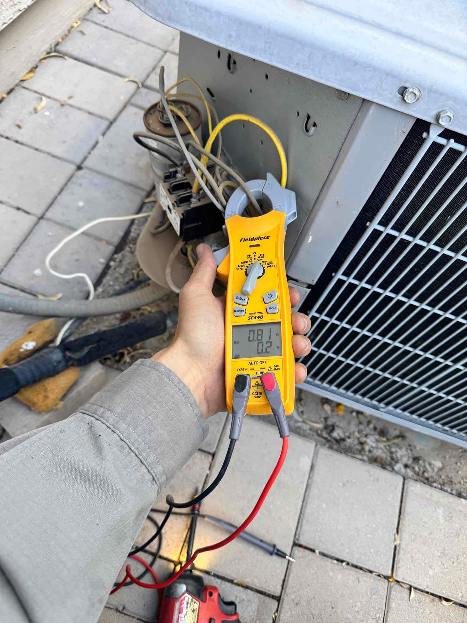 HVAC diagnostic instrument photographed during the service visit.