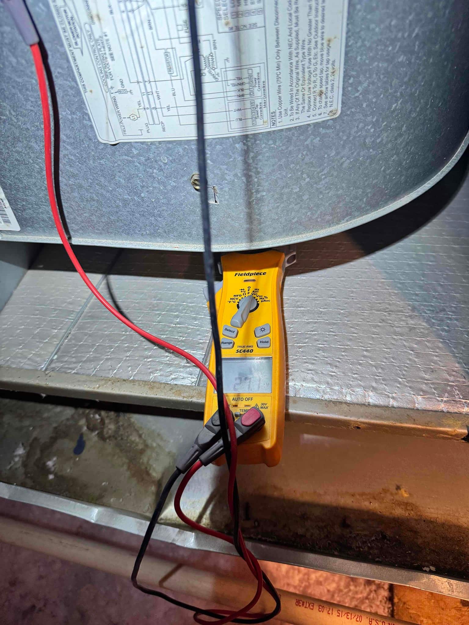 HVAC diagnostic instrument photographed during the service visit.