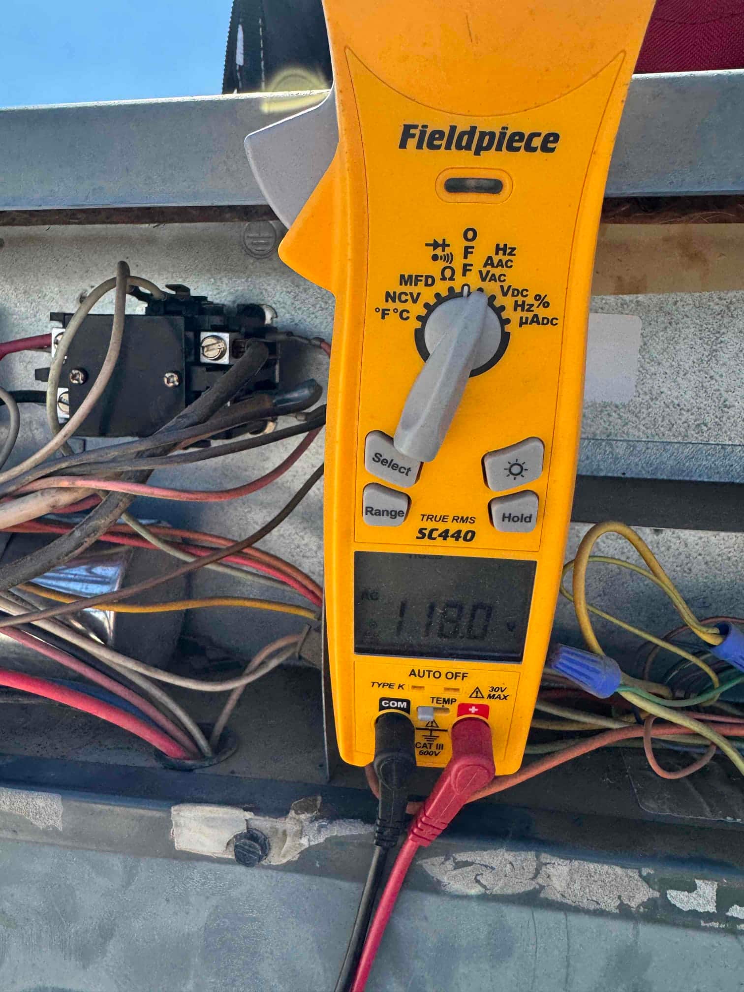HVAC diagnostic instrument photographed during the service visit.