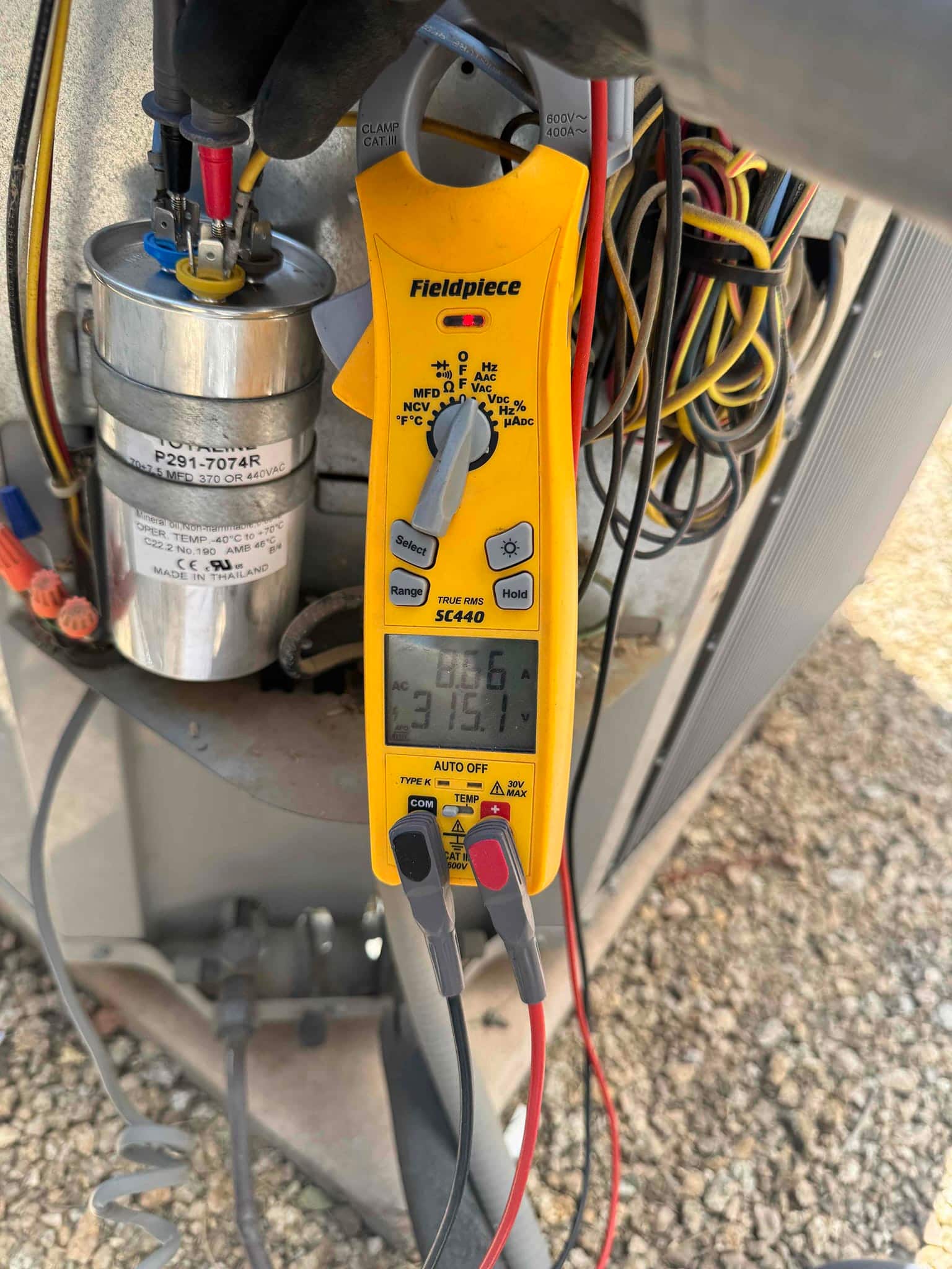 HVAC diagnostic instrument photographed during the service visit.