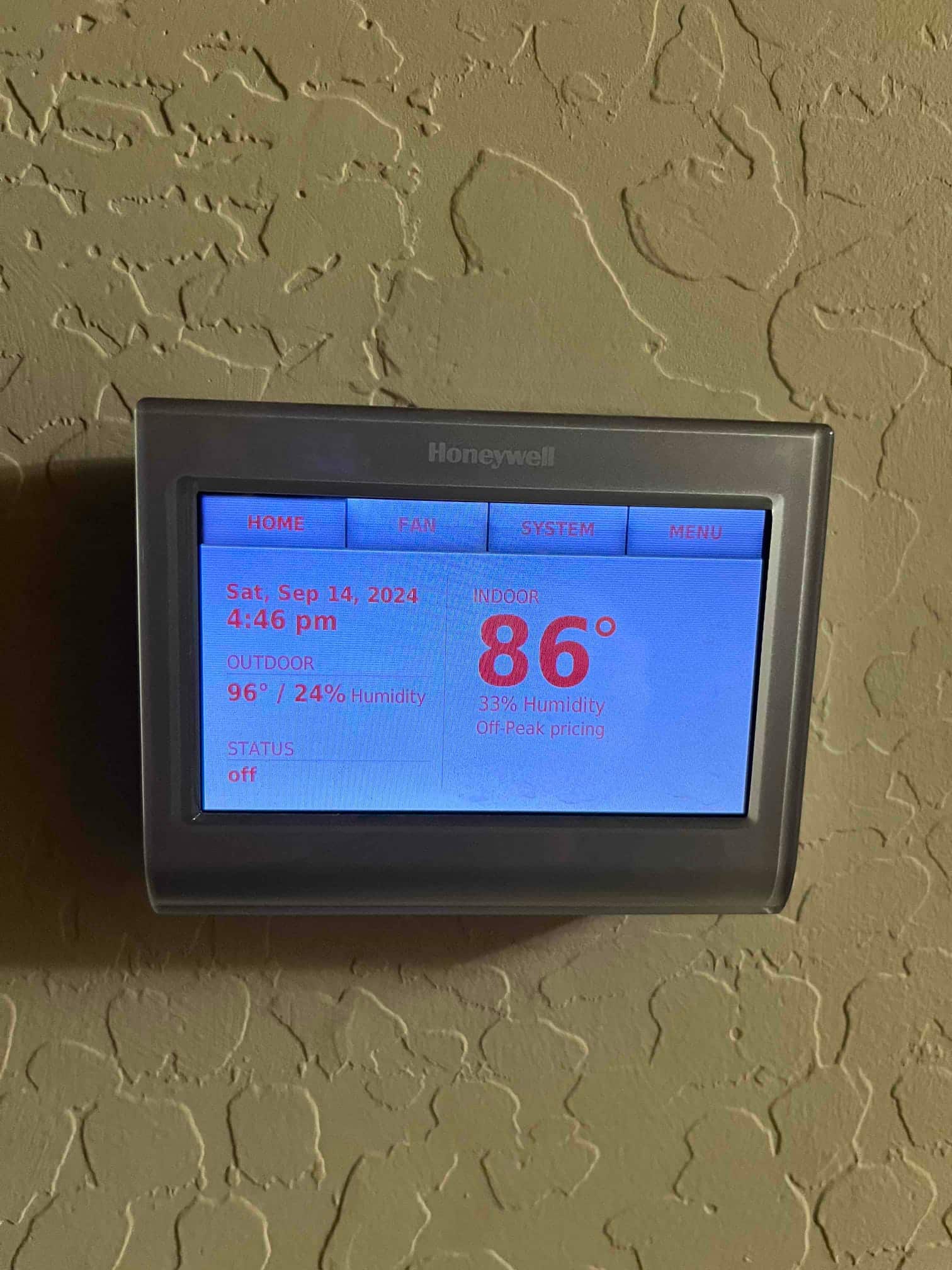 Thermostat display shows indoor 86° with 33% humidity, outdoor 96° with 24% humidity, system status off.
