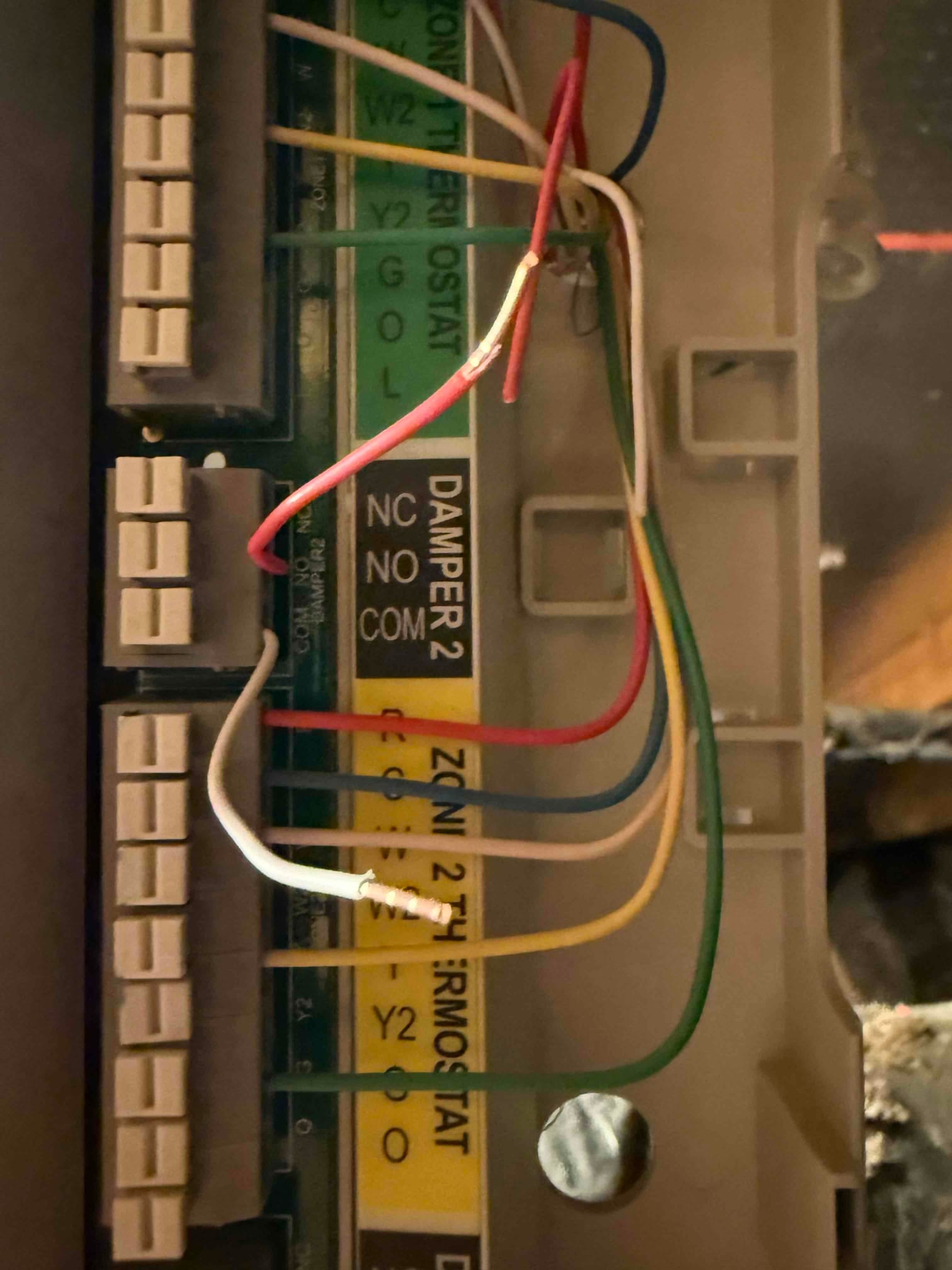 Zone control board terminals showing R, C, W, Y, G connections with red, white, green, yellow wires and exposed copper segments.