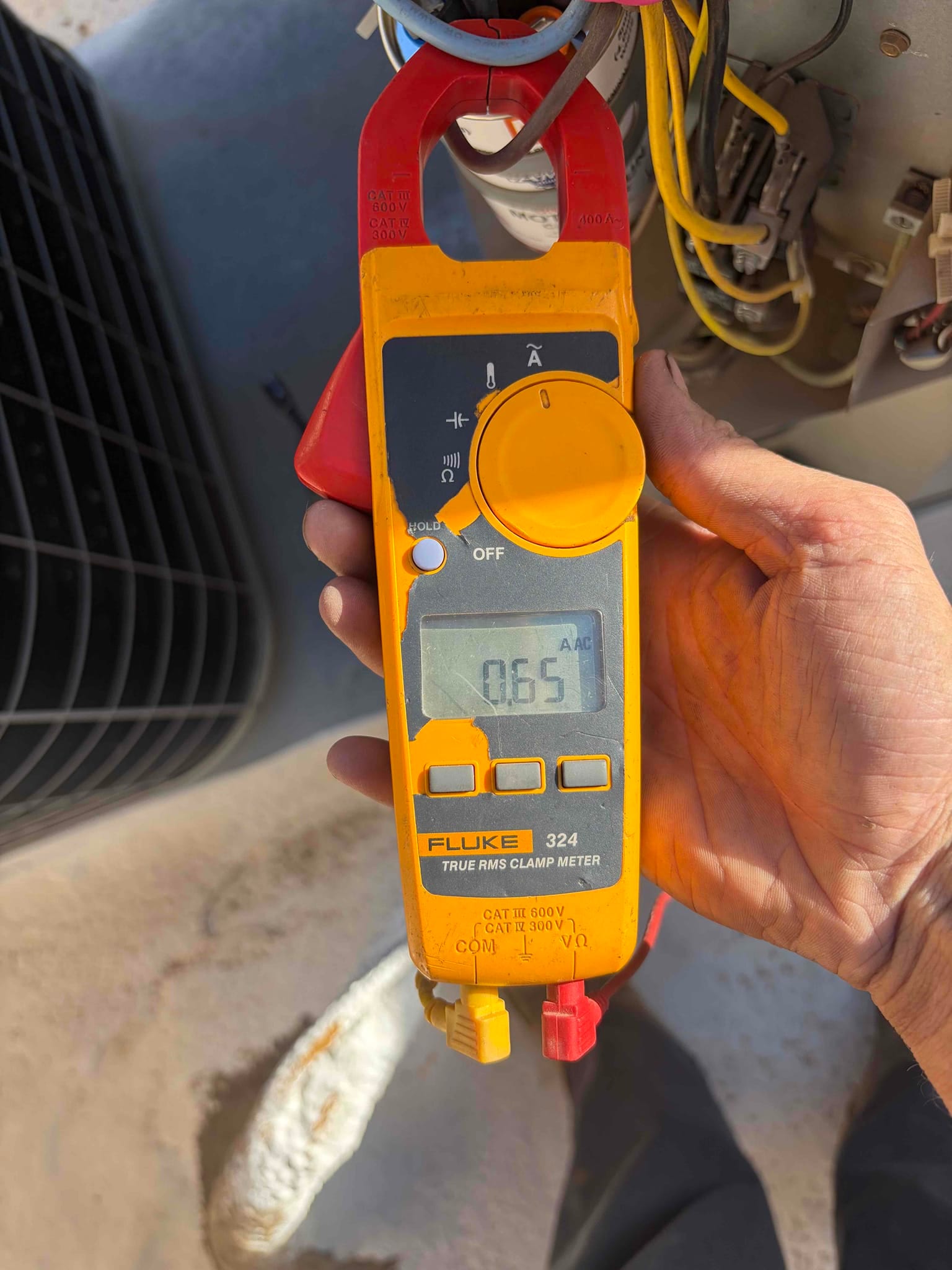 Diagnostic instrument display shows 0.65 A.